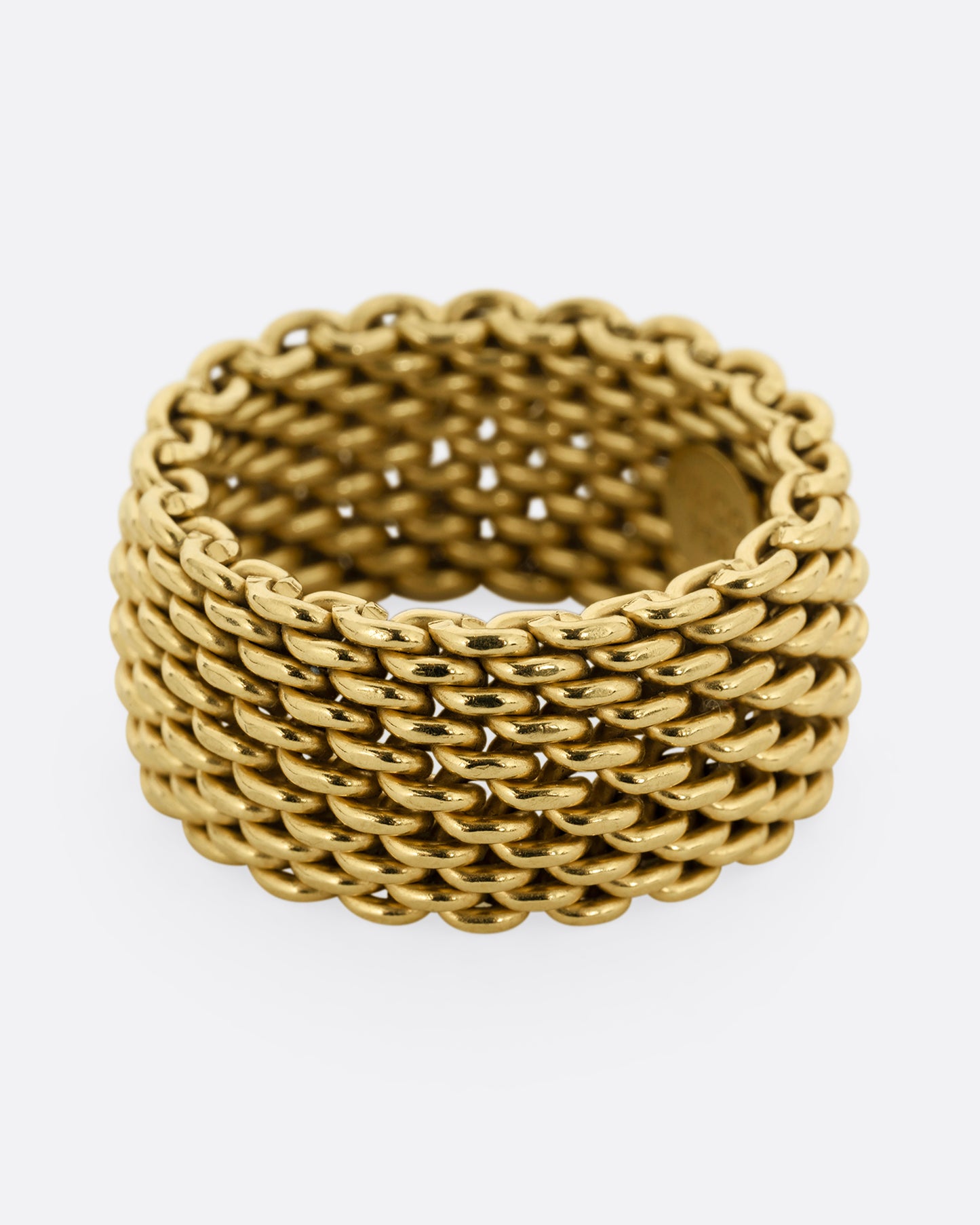 A yellow gold mesh Tiffany and Co. ring.