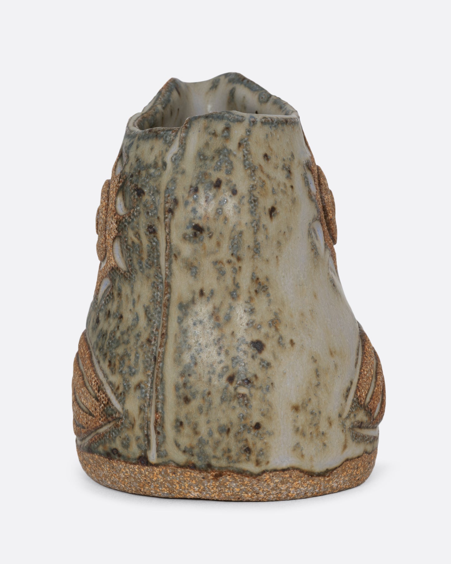 A spotted bird shaped creamer. Shown from the back.