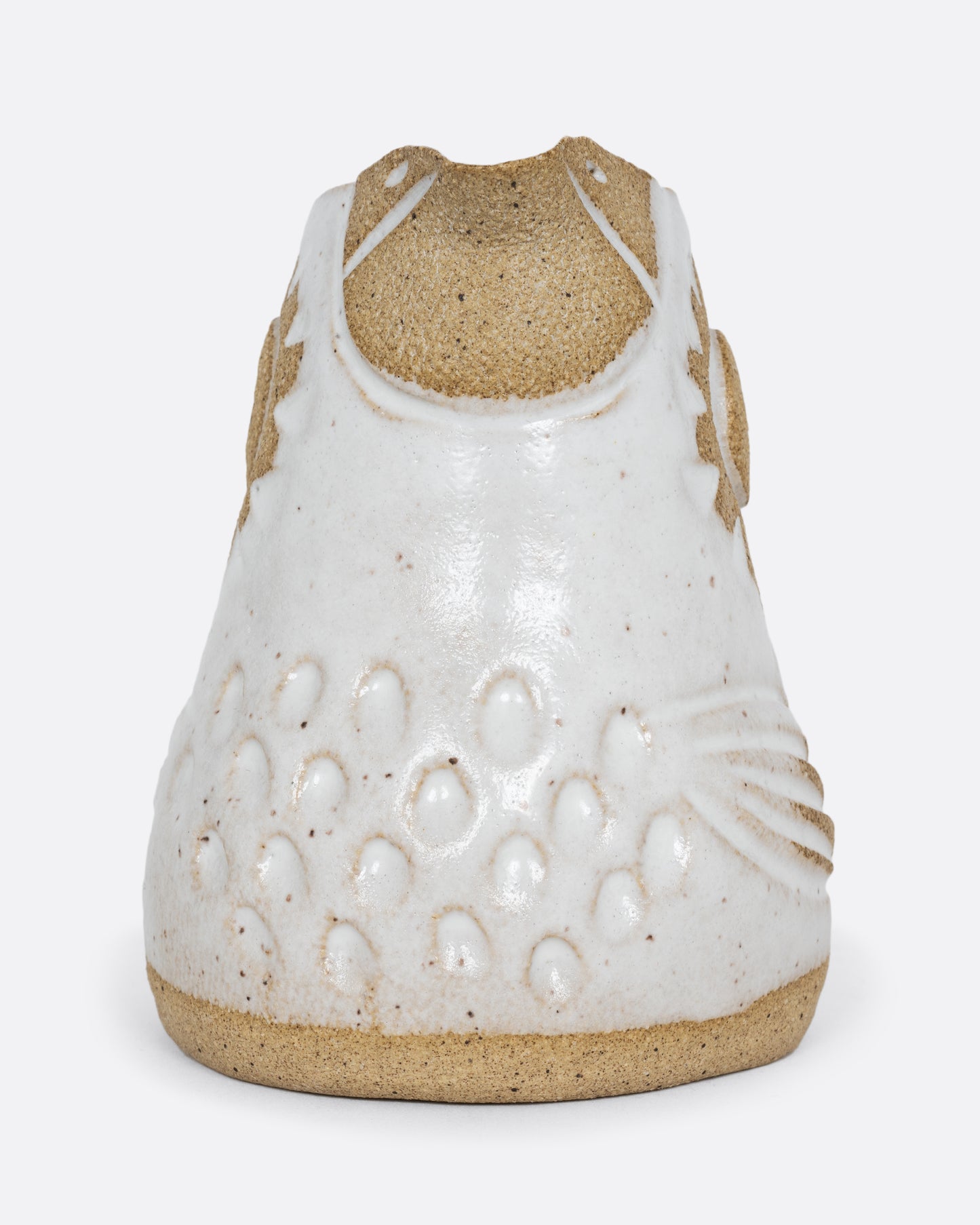 A white bird shaped creamer with a handle. Shown from the front.
