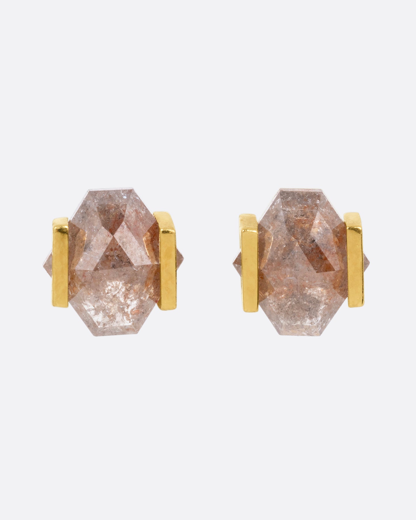 Yellow gold earrings with rustic diamonds in open rectangular settings. Shown from the front.