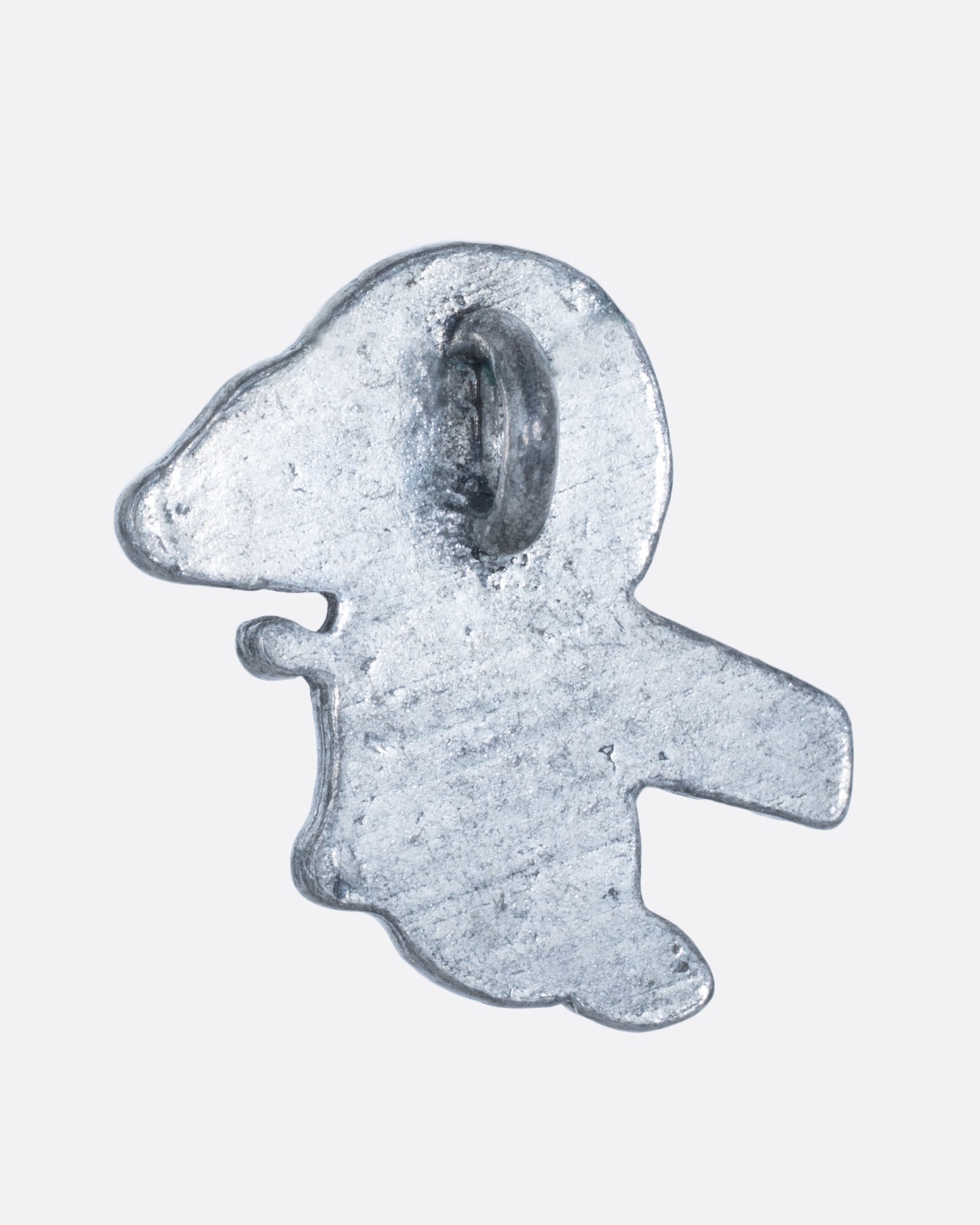A silver snoopy charm with turquoise and coral chips inlay. Shown from the back.
