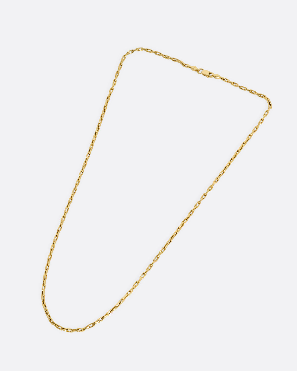 A yellow gold box chain with elongated links, shown from the front.