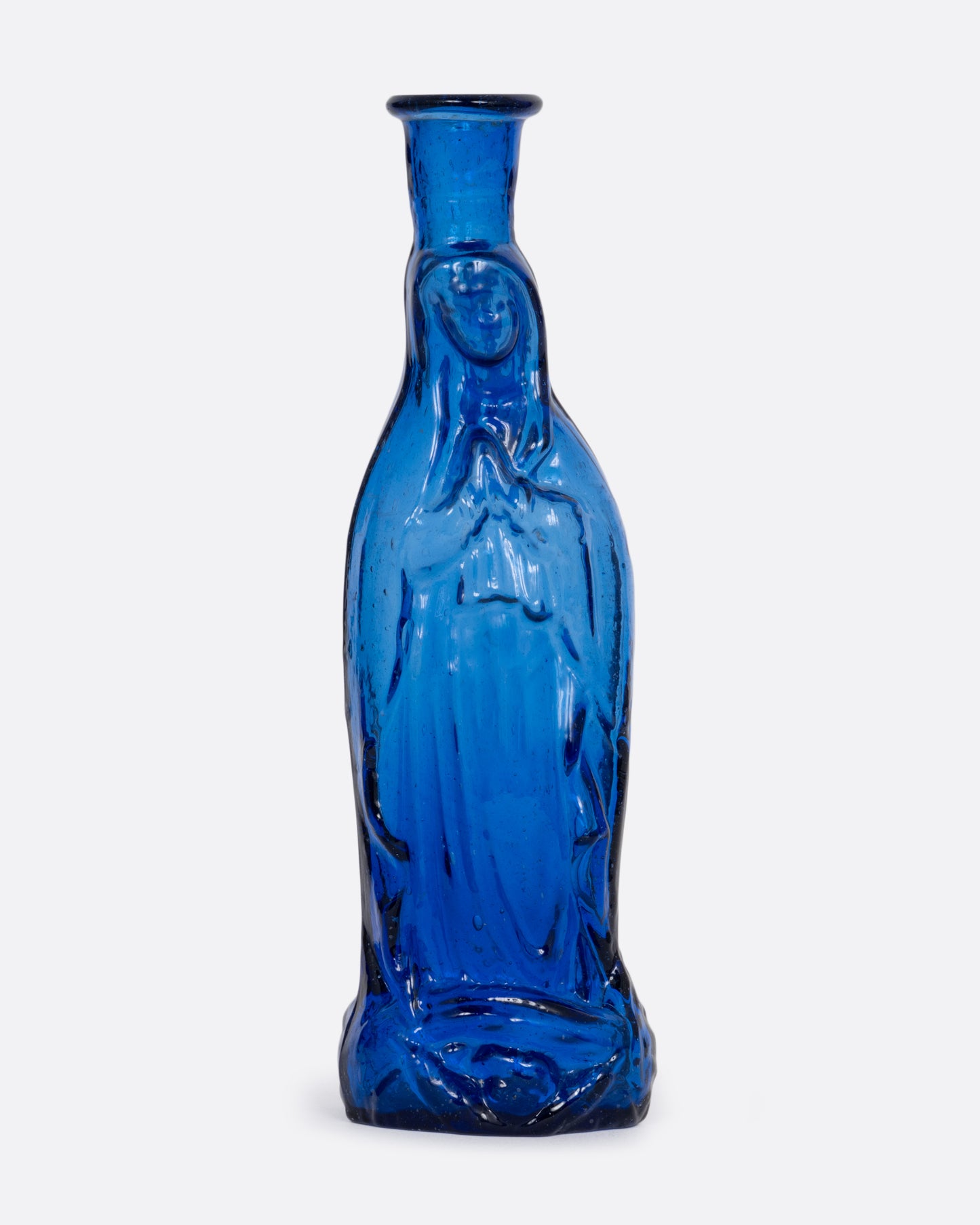 A blue glass vase with a praying Madonna. Shown from the front.