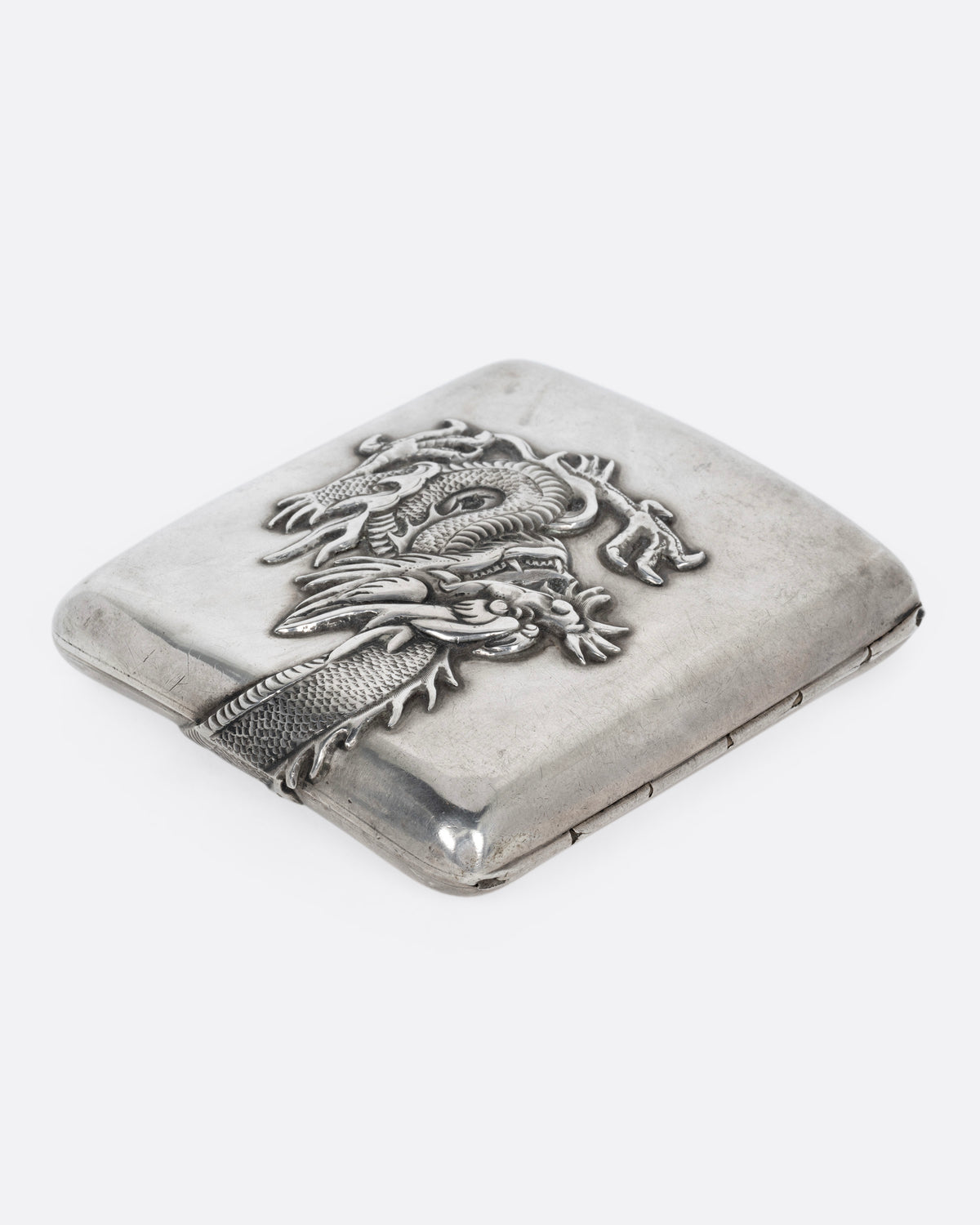 A silver box with a wagon on it, shown from the side.