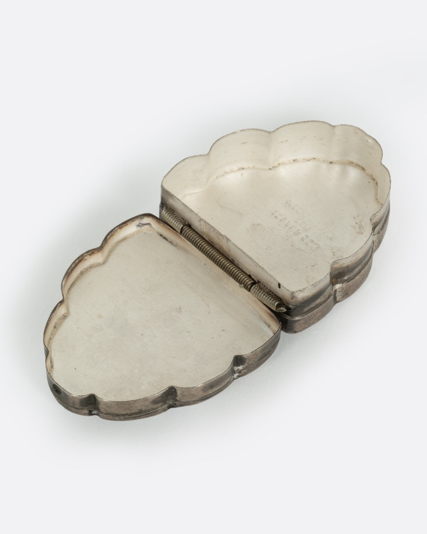 A Mexican silver and abalone box, shown open from the top.