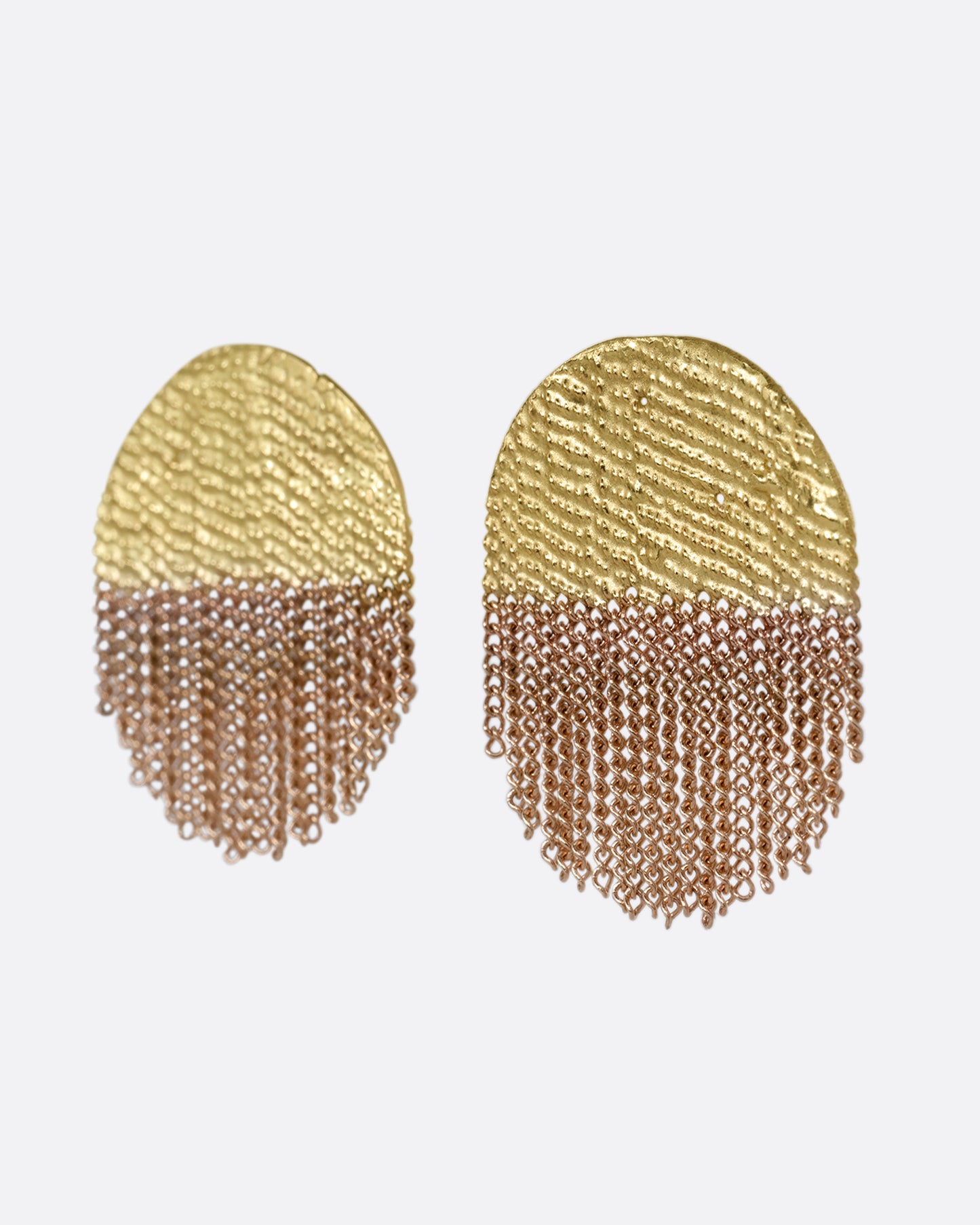 A yellow gold circular stud back earring that's half solid and half fringe chain. Shown from the side.