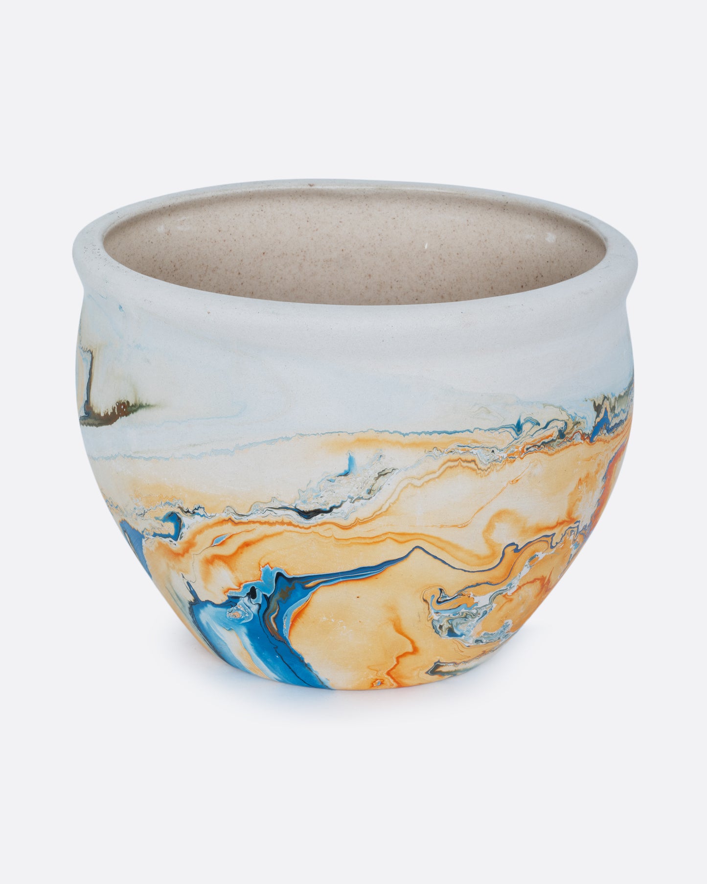A white Nemadji pot with swirls of blues and golds shown from the side.