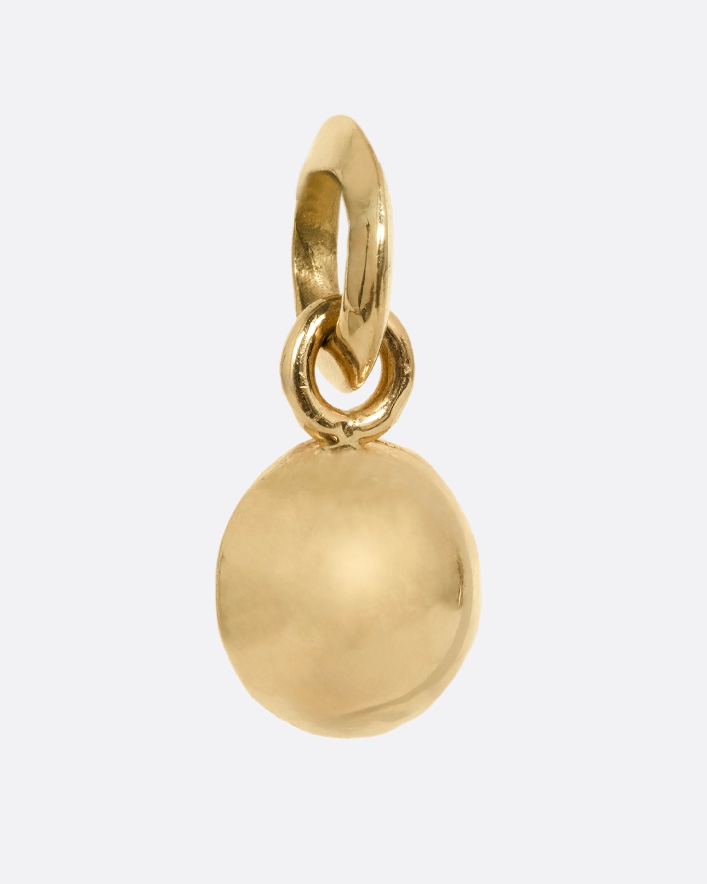 A round yellow gold pendant with an Old European cut diamond. Shown from the back.