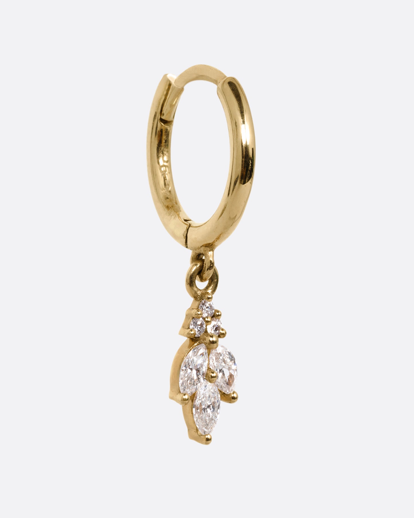A yellow gold hoop with a marquise diamond flower dangle at the base, shown from the side.