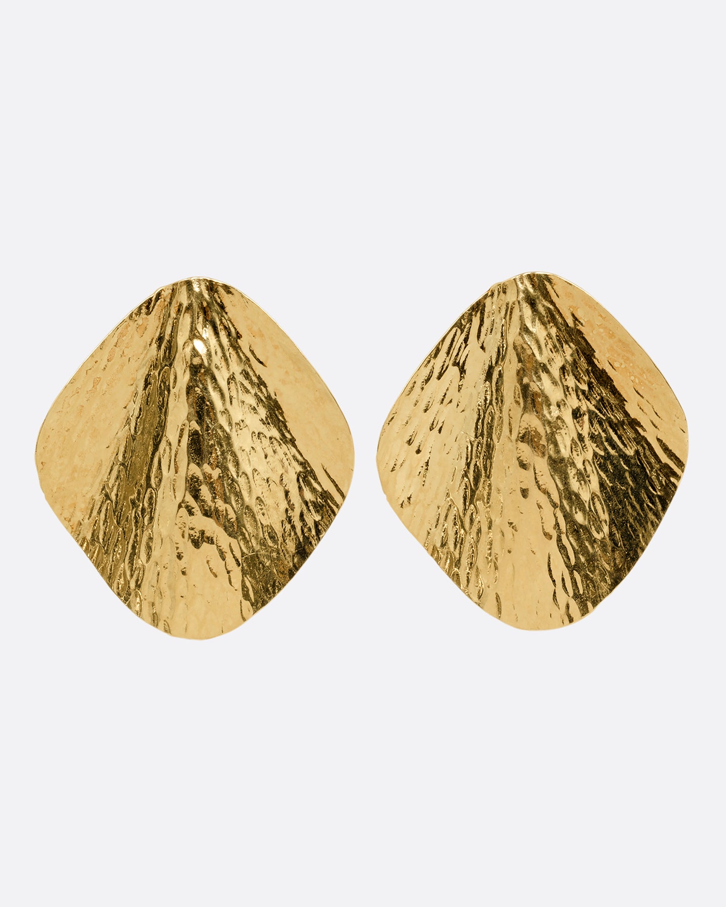 A pair of yellow gold stud earrings with a textural finish and wavy silhouette, shown from the front.