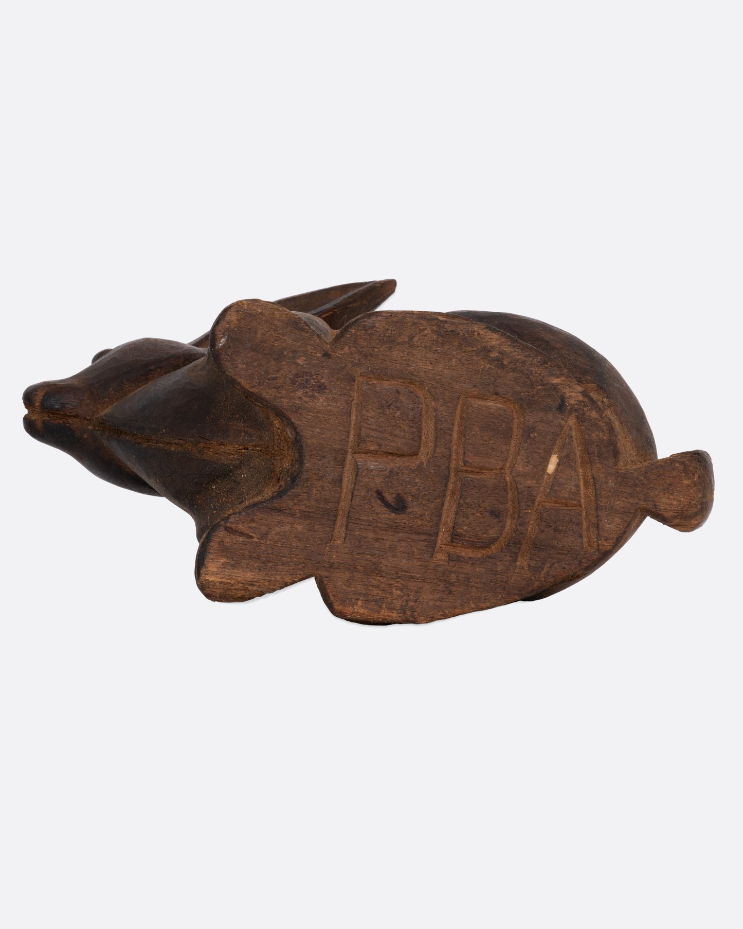 A wooden rabbit takaan sculpture shown from the bottom.