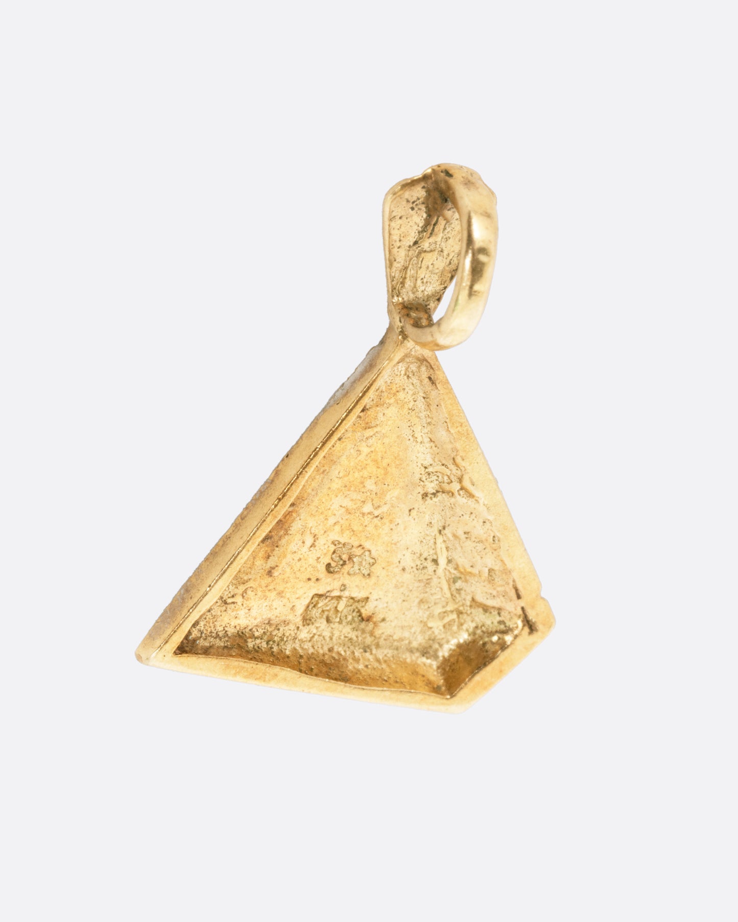 A yellow gold pyramid pendant shown from the back.