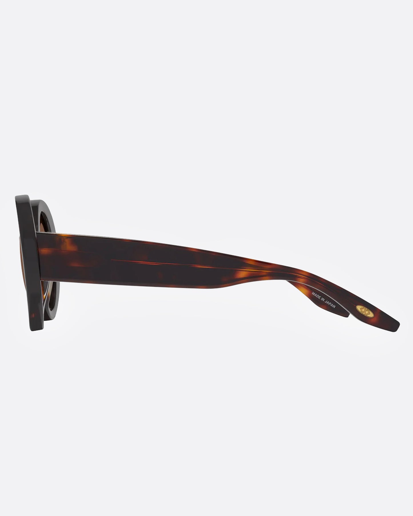 A pair of cat-eye sunglasses with tortoiseshell frame and brown lenses, shown from the side.