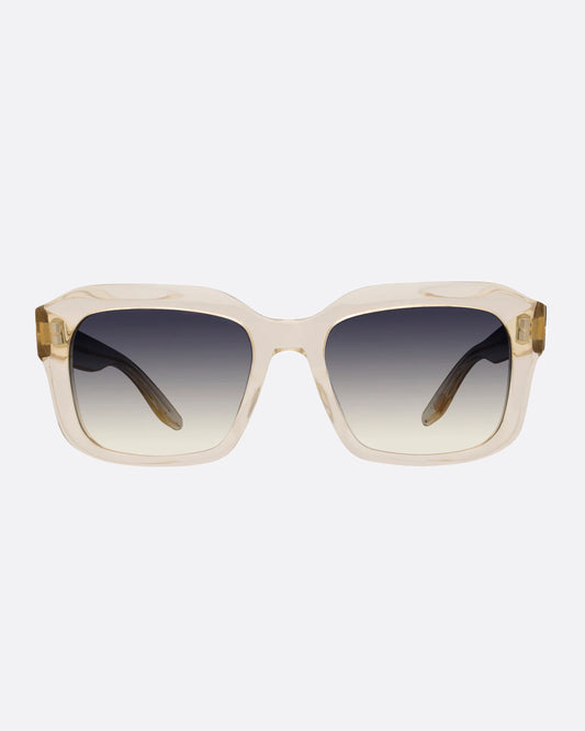 A pair of clear champagne acetate sunglasses with gray ombré lenses.