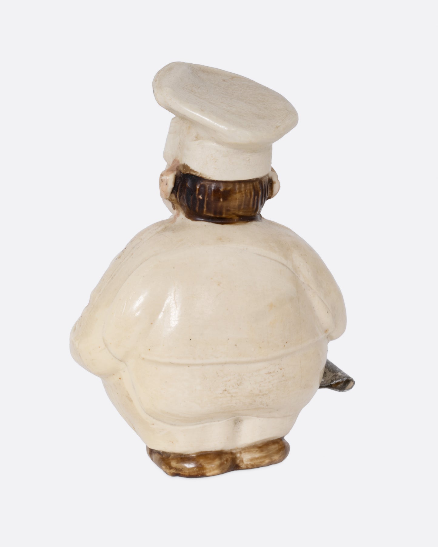 A chef shaped tape measurer, shown from the back.