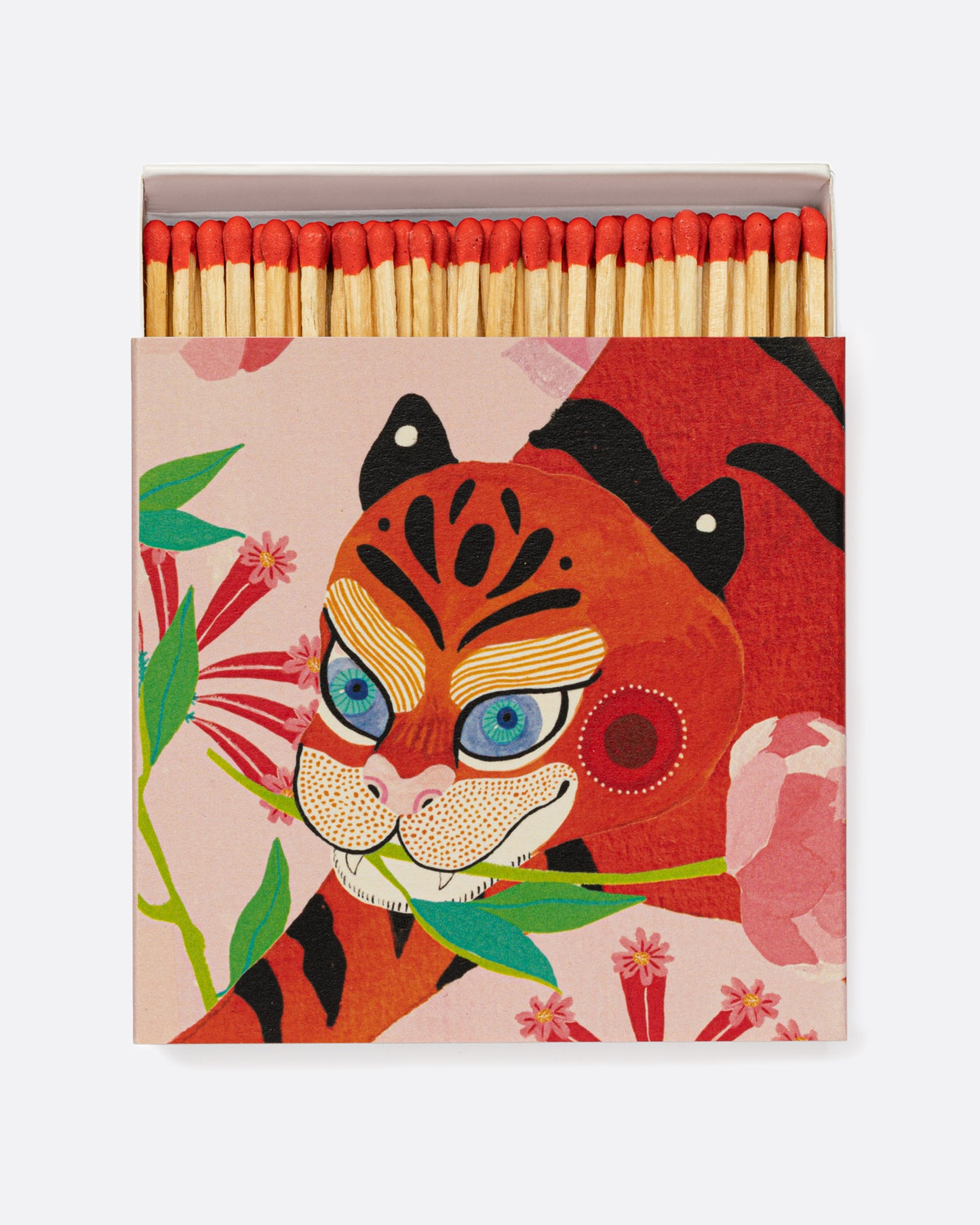 An open matchbox with red tipped wooden matches. The cover has a red cat holding a flower in its mouth. Shown from the top.