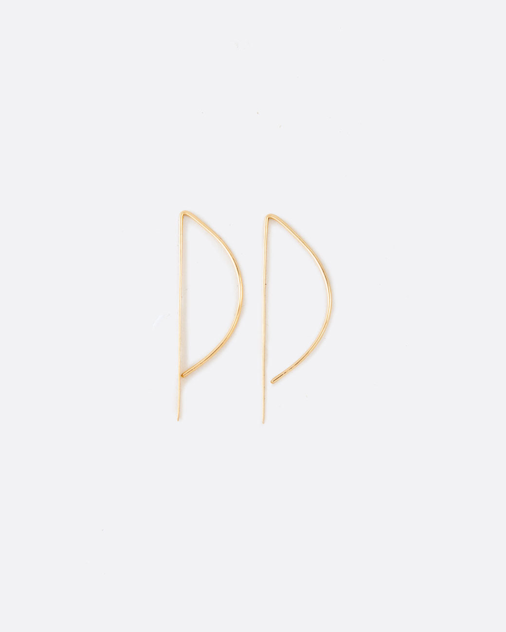 A unique take on a hoop earring with a flat edge that catches the light.