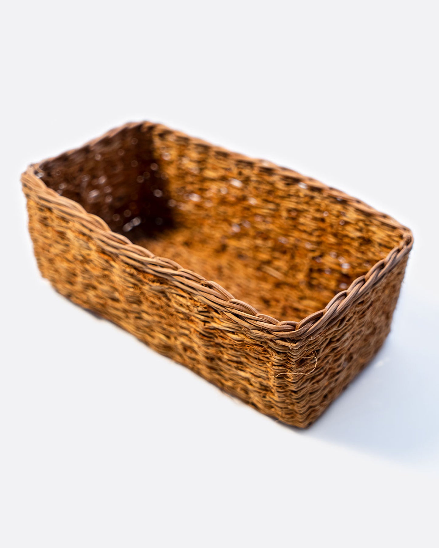 A rectangular vetiver basket. Shown at an angle from the top.