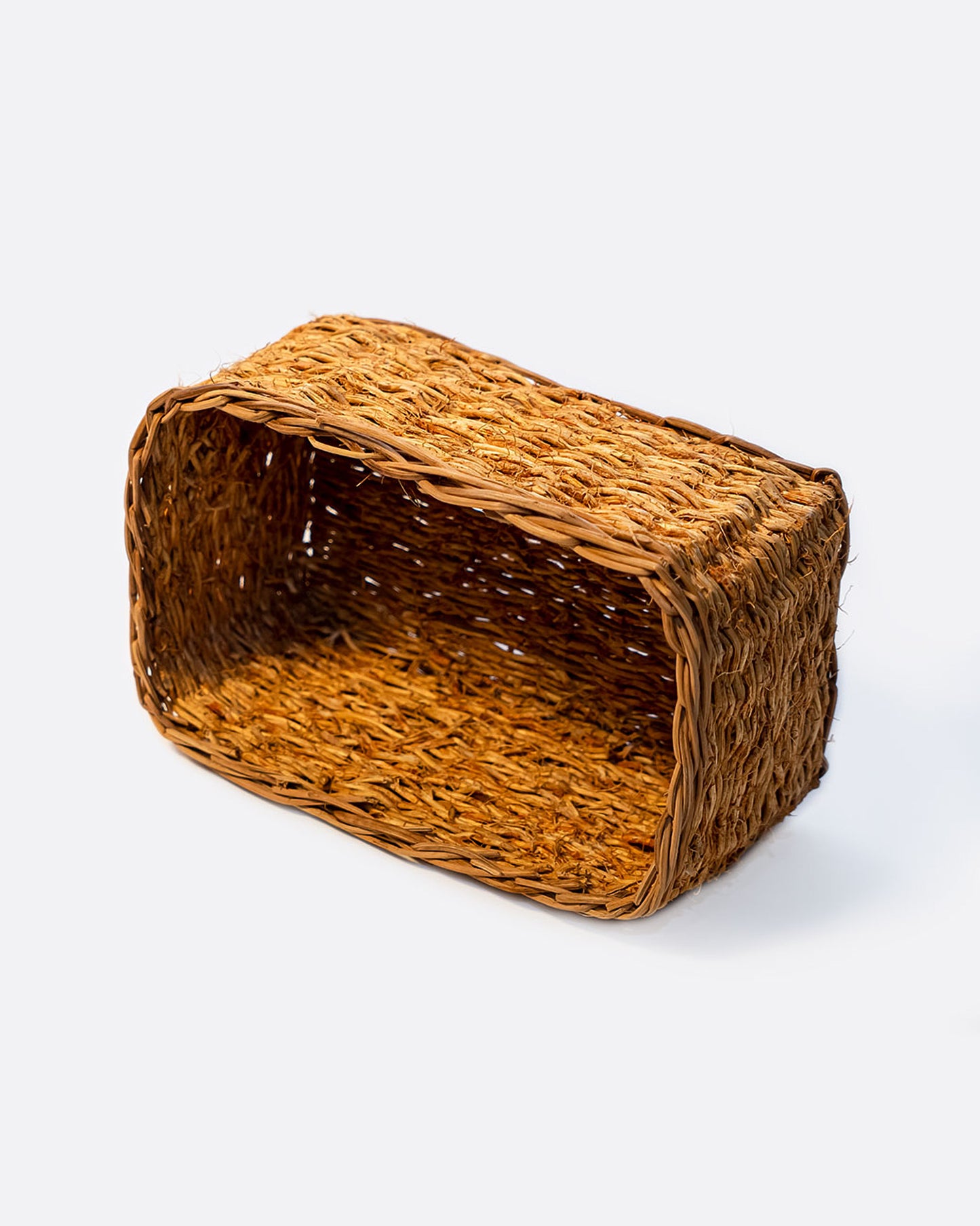 A rectangular vetiver basket shown on its side at an angle from the top.