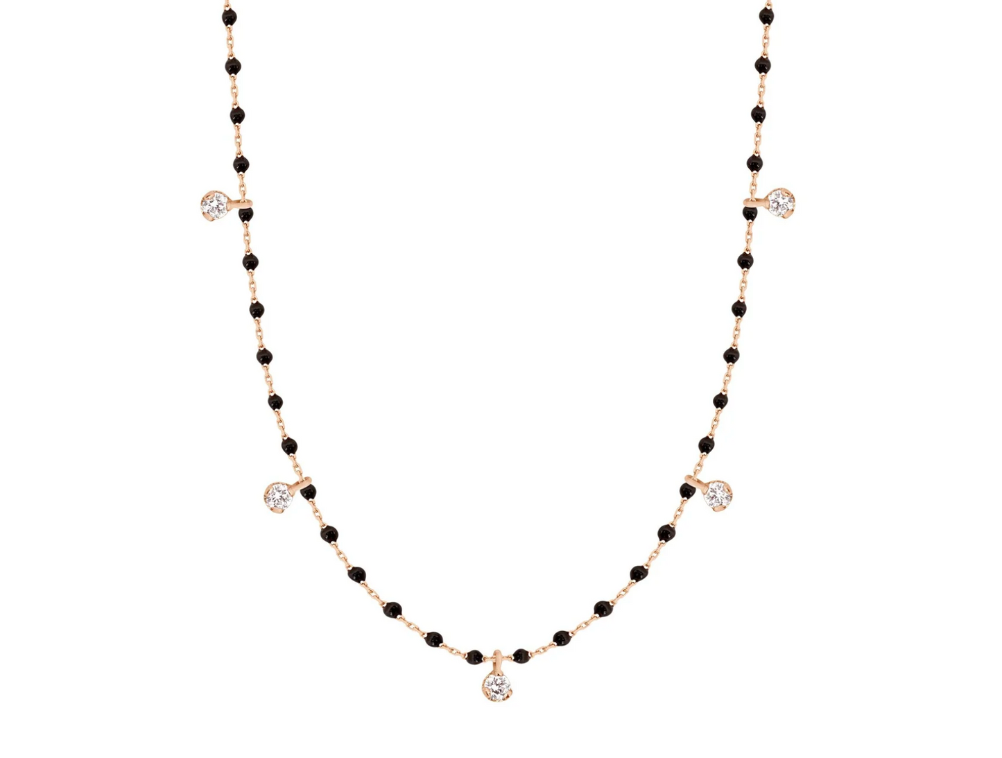 A rose gold cable chain necklace with droplets of black resin and five diamond charms. Shown from the front.