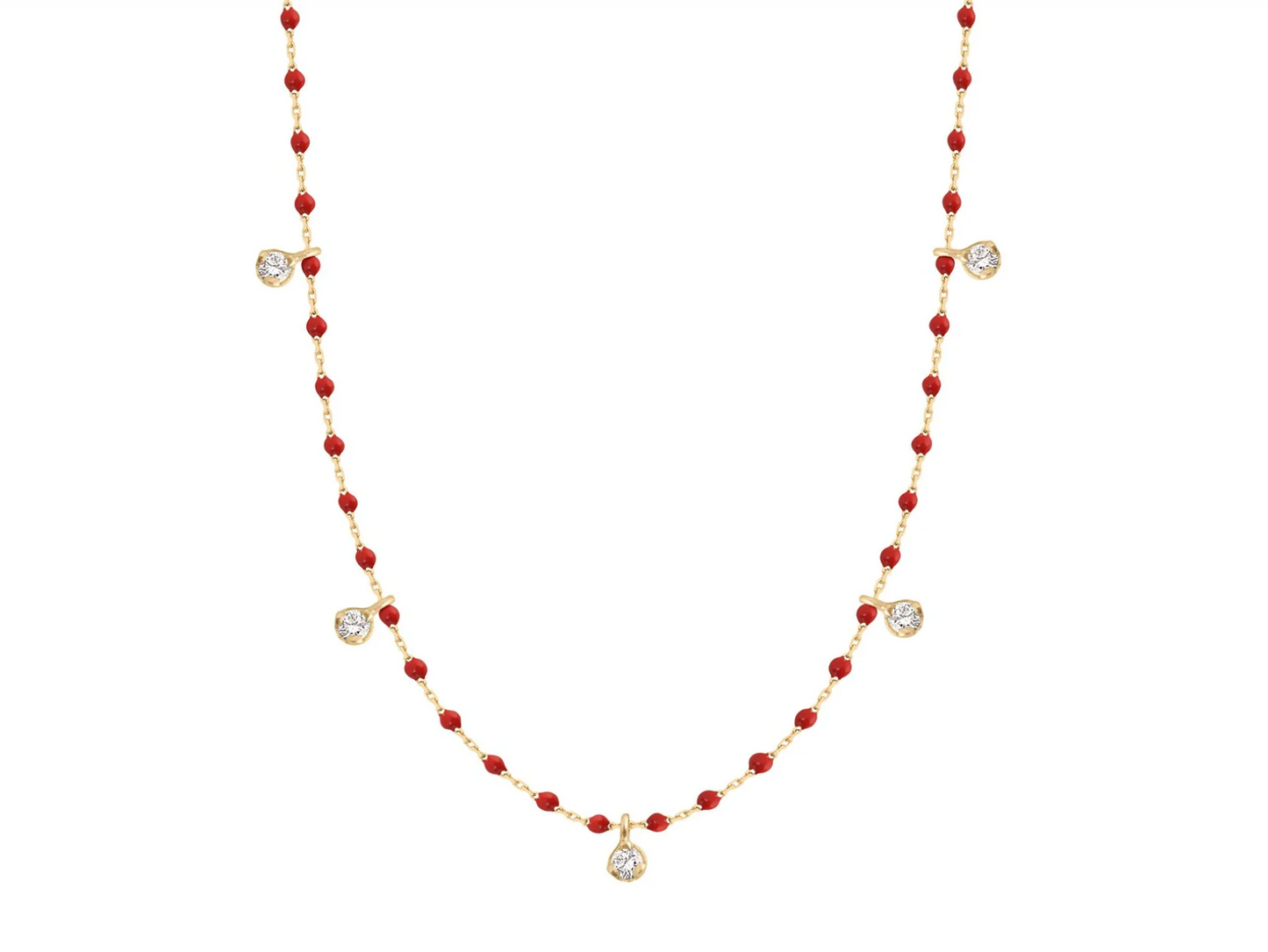 A yellow gold cable chain necklace with droplets of red resin and five diamond charms. Shown from the front.