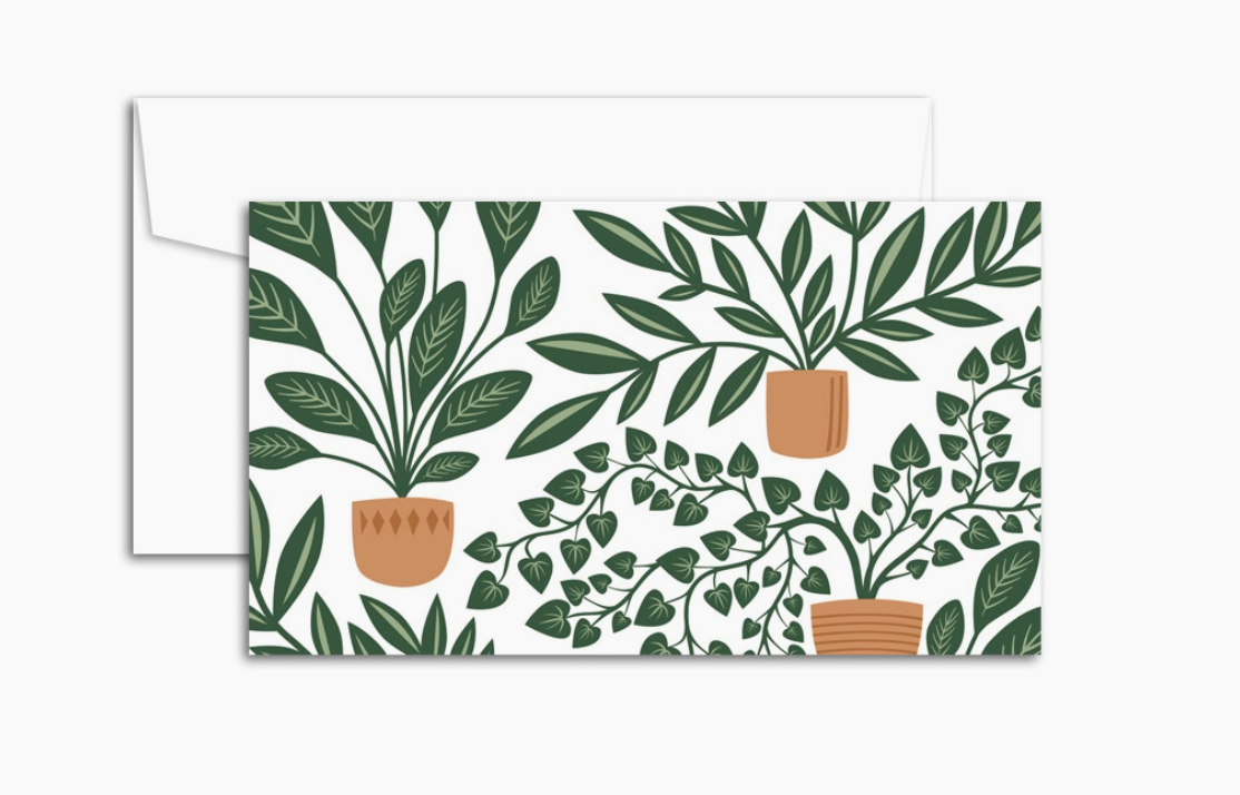 A white envelope with a potted plant printed note card resting on top. Shown lying flat.