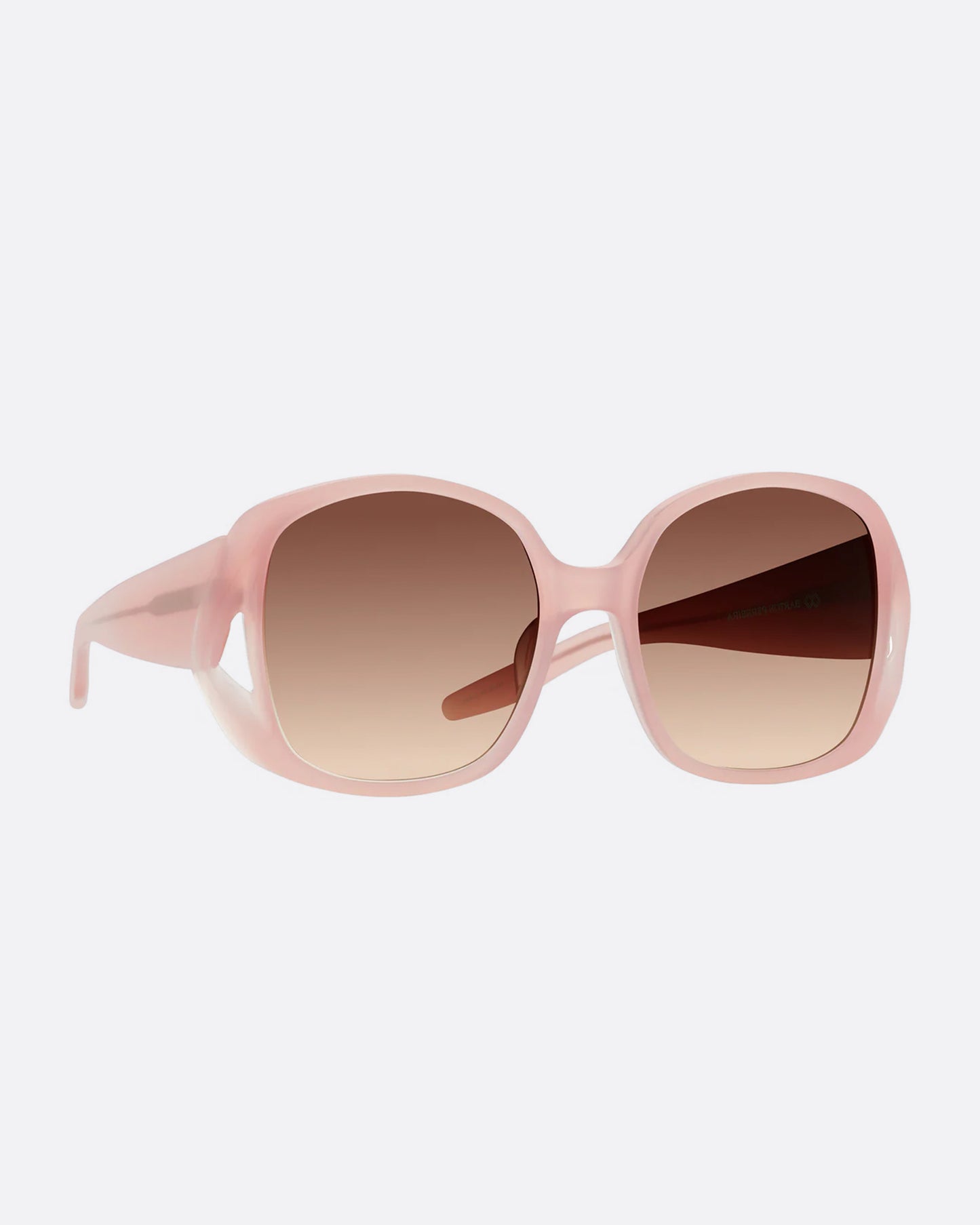 A pair of pink sunglasses with gradient lenses, shown from the side.