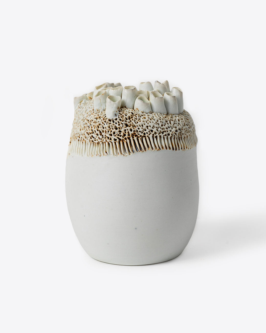 Handmade porcelain barnacle motif vase by Jo Boyer. Shown from the front.