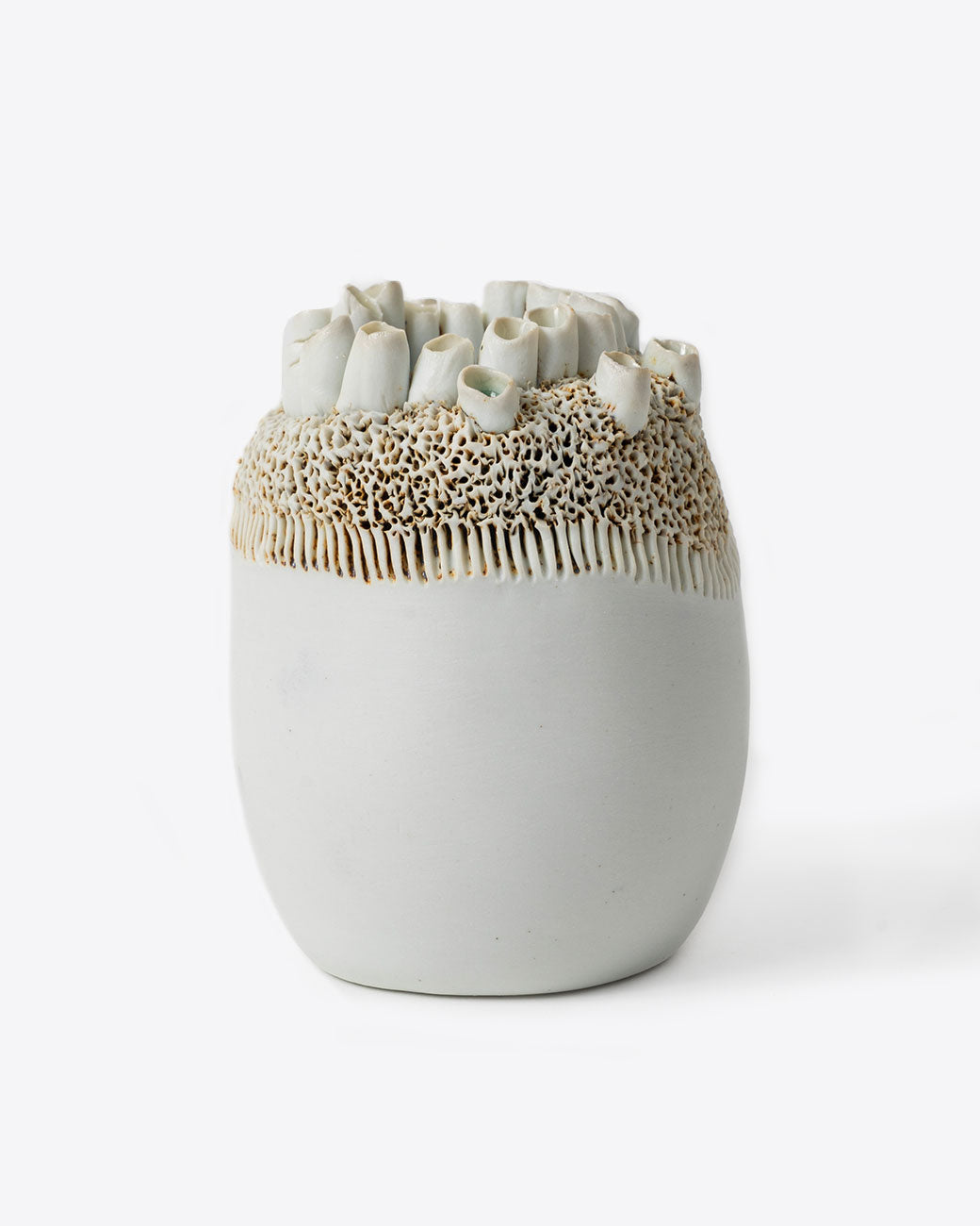 Handmade porcelain barnacle motif vase by Jo Boyer. Shown from the front.
