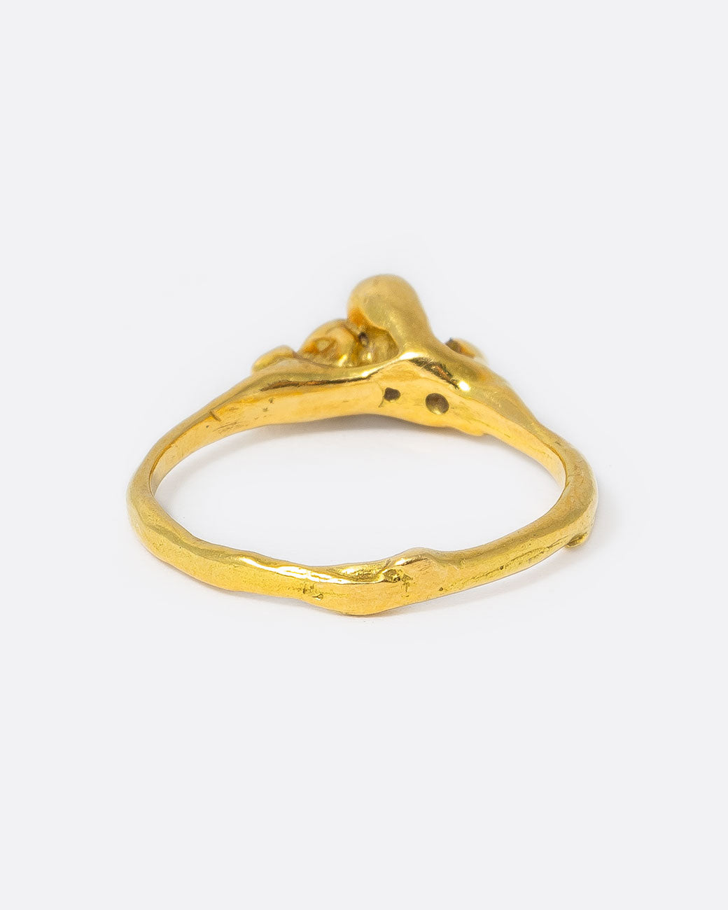 18k yellow gold teeny sea anemone ring with pink sapphires, orange sapphires, and diamonds by Kimberlin Brown, shown from the back.