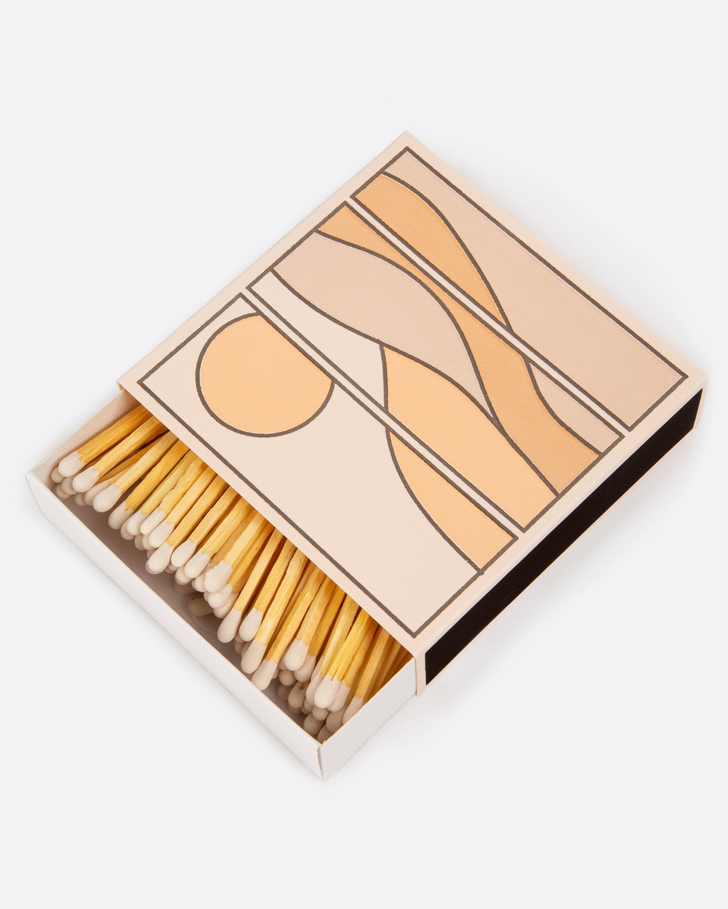 An open matchbox with white tipped wooden matches. The cover has a tan, peach, and pink landscape scene. Shown at an angle from the top.