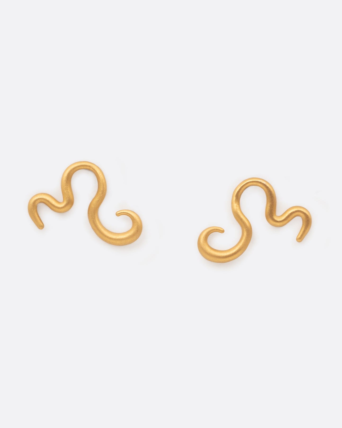 A pair of curved 22k yellow gold snake stud earring. Shown from the front.