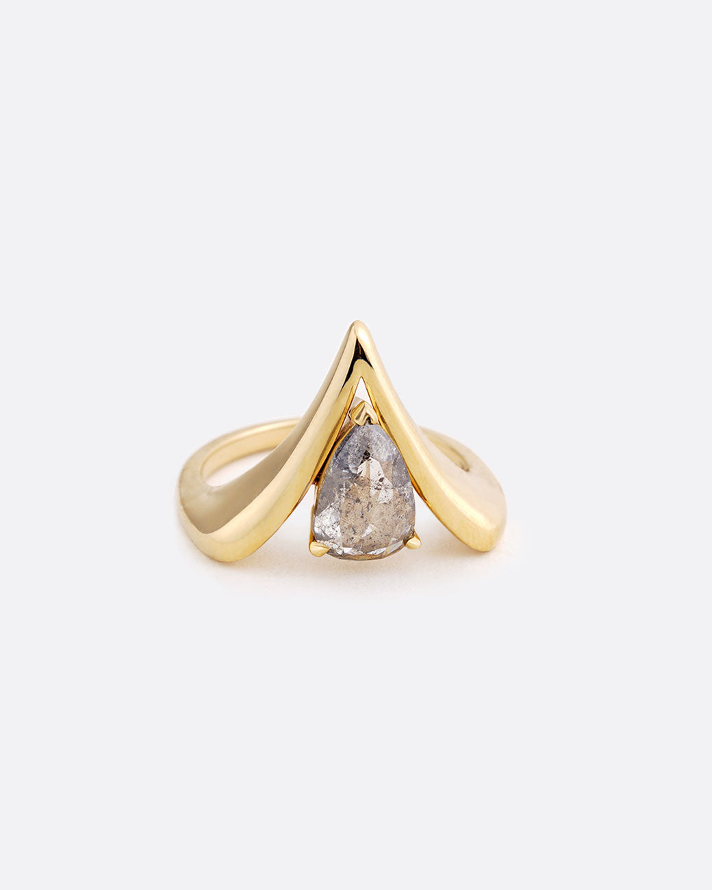A yellow gold reversed V shaped ring with pear shaped salt and pepper diamond at the center. Shown from the front.