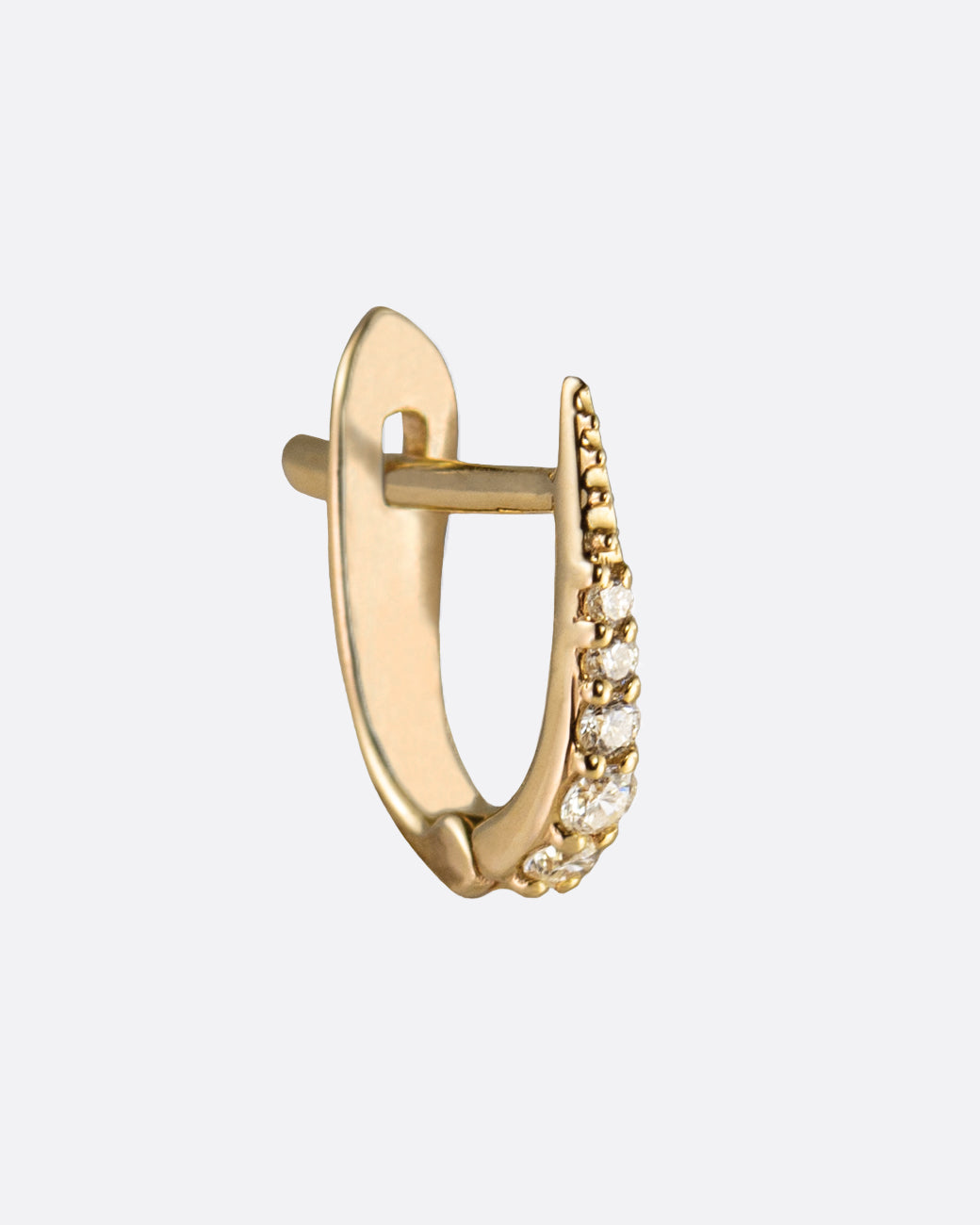 A yellow gold pointed hoop with diamonds. Shown from the side.