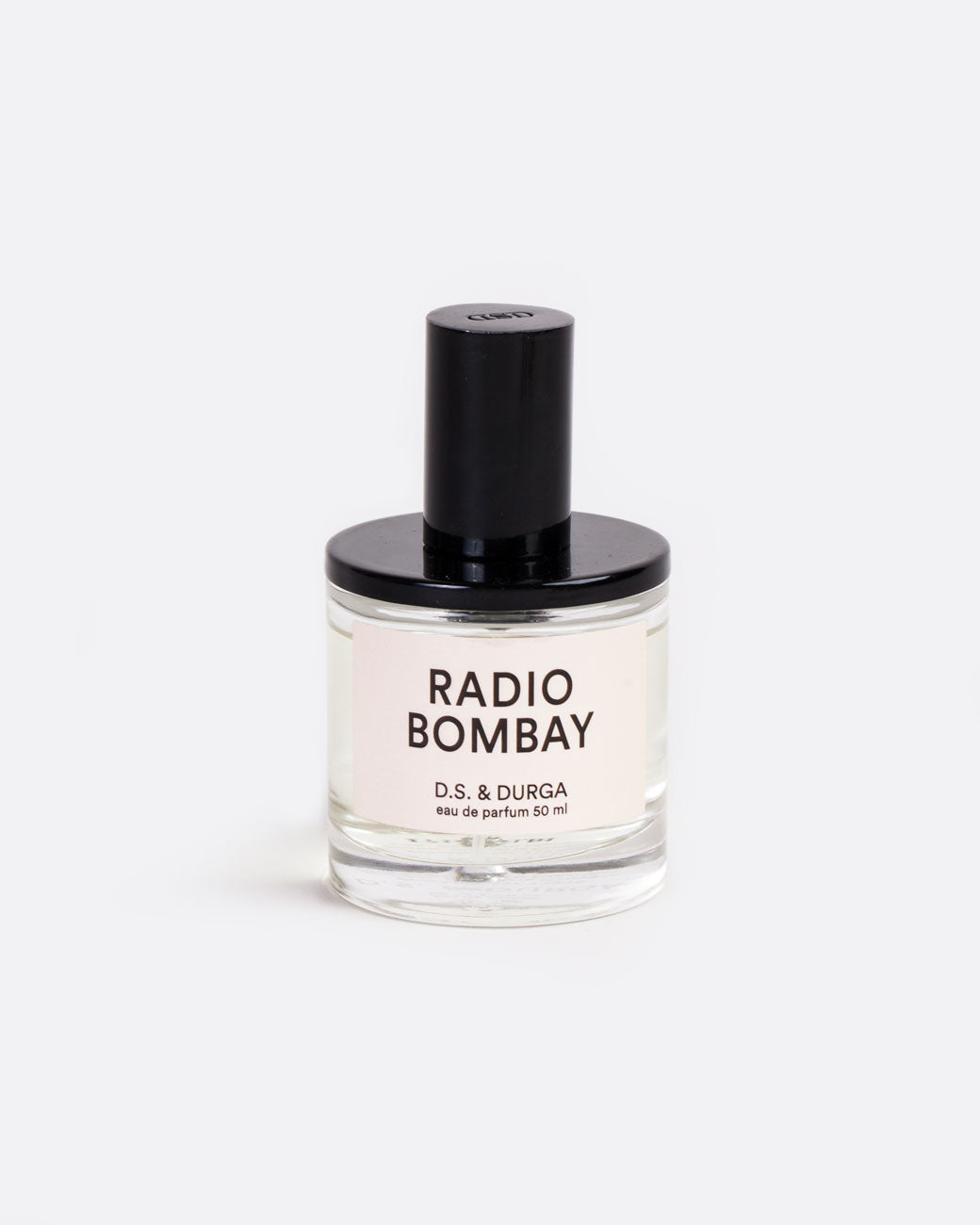 A glass bottle with a label that reads: Radio Bombay D.S. & Durga eau de parfum 50 ml with black shiny spritzer top. Shown from the front.