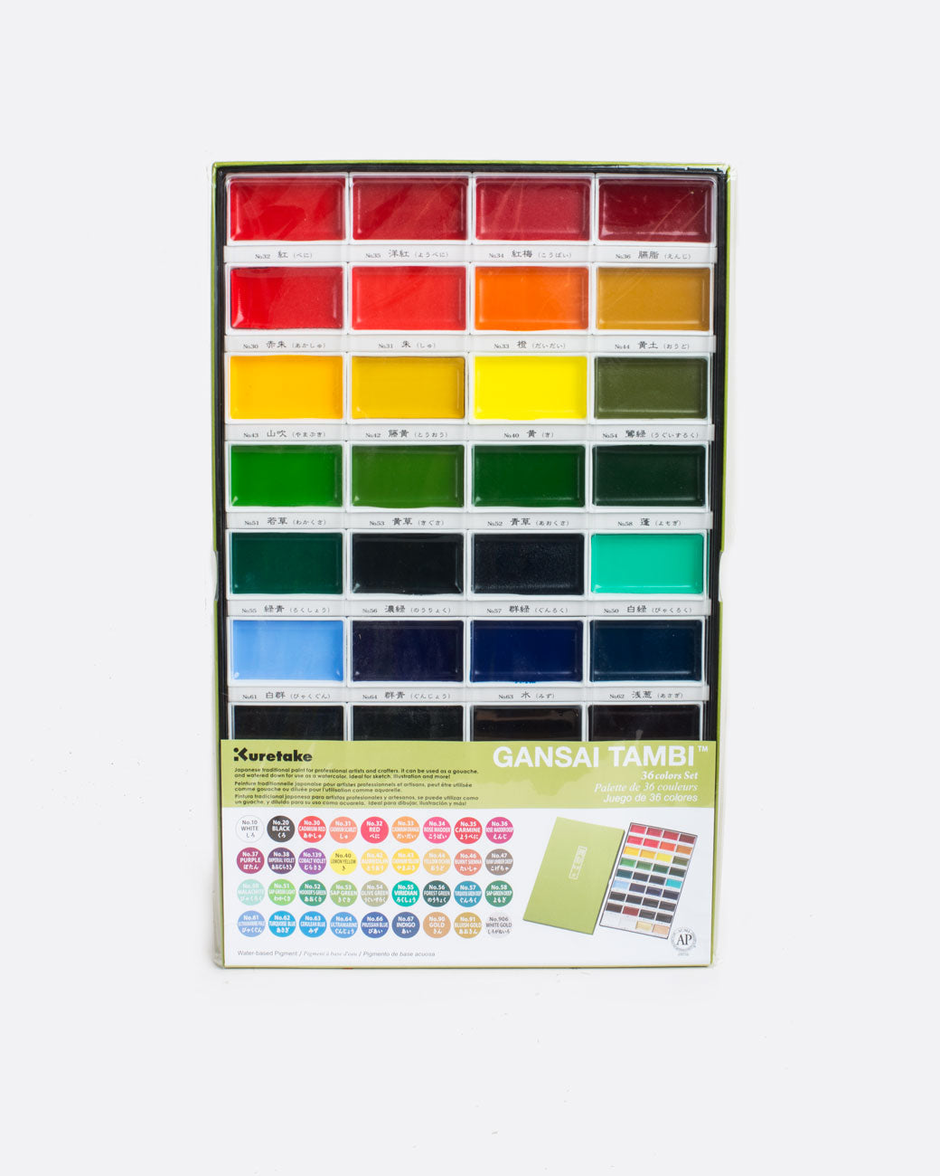 A gansai tambi watercolor set with a grid of 4 columns and 9 rows of watercolor pans. Pictured in packaging with brand notes obscuring most of the last 3 rows. Shown from the front.