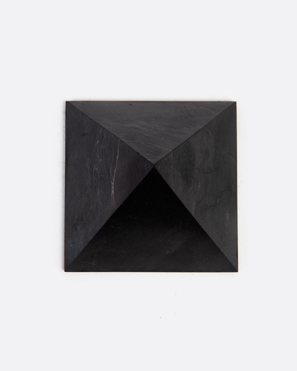 A black stone pyramid. Shown from the top.
