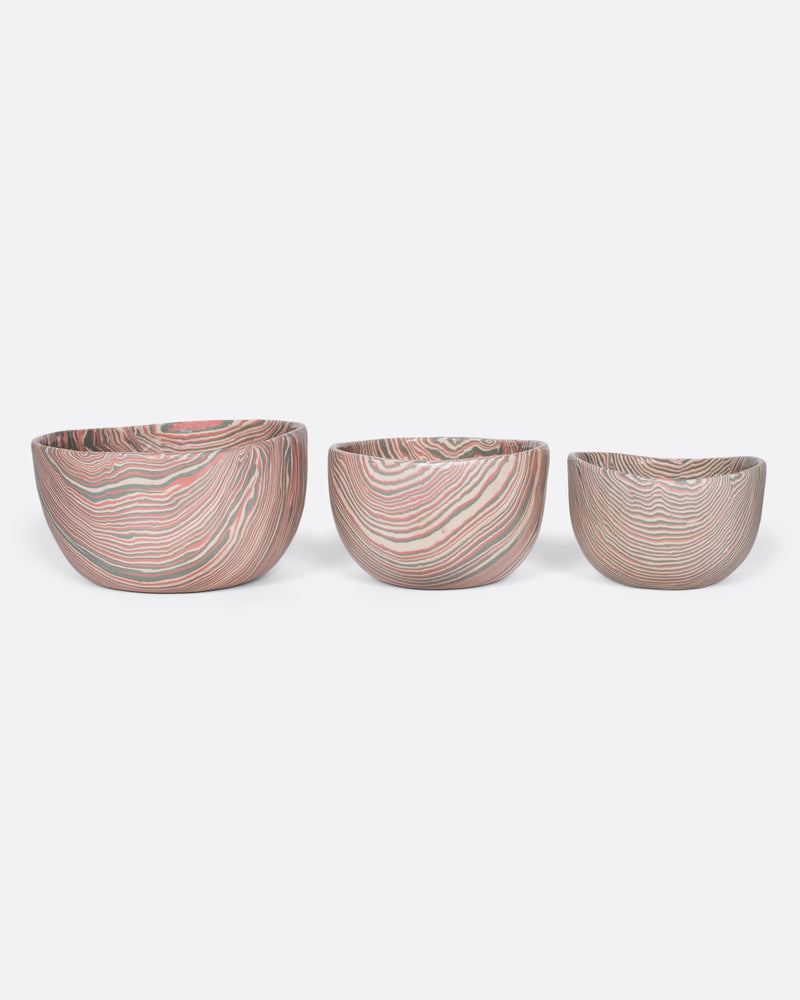 Sam Andrew nerikomi bowl in pink and gray stripes, a handmade bowl with swirling marbled clay, shown with the other sizes