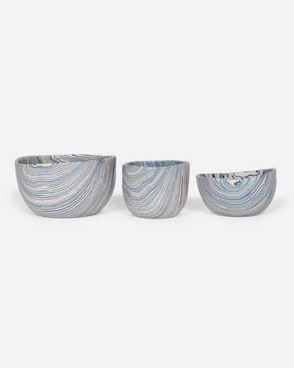 Blue and cream marbled ceramic bowl, shown in a row of three sizes