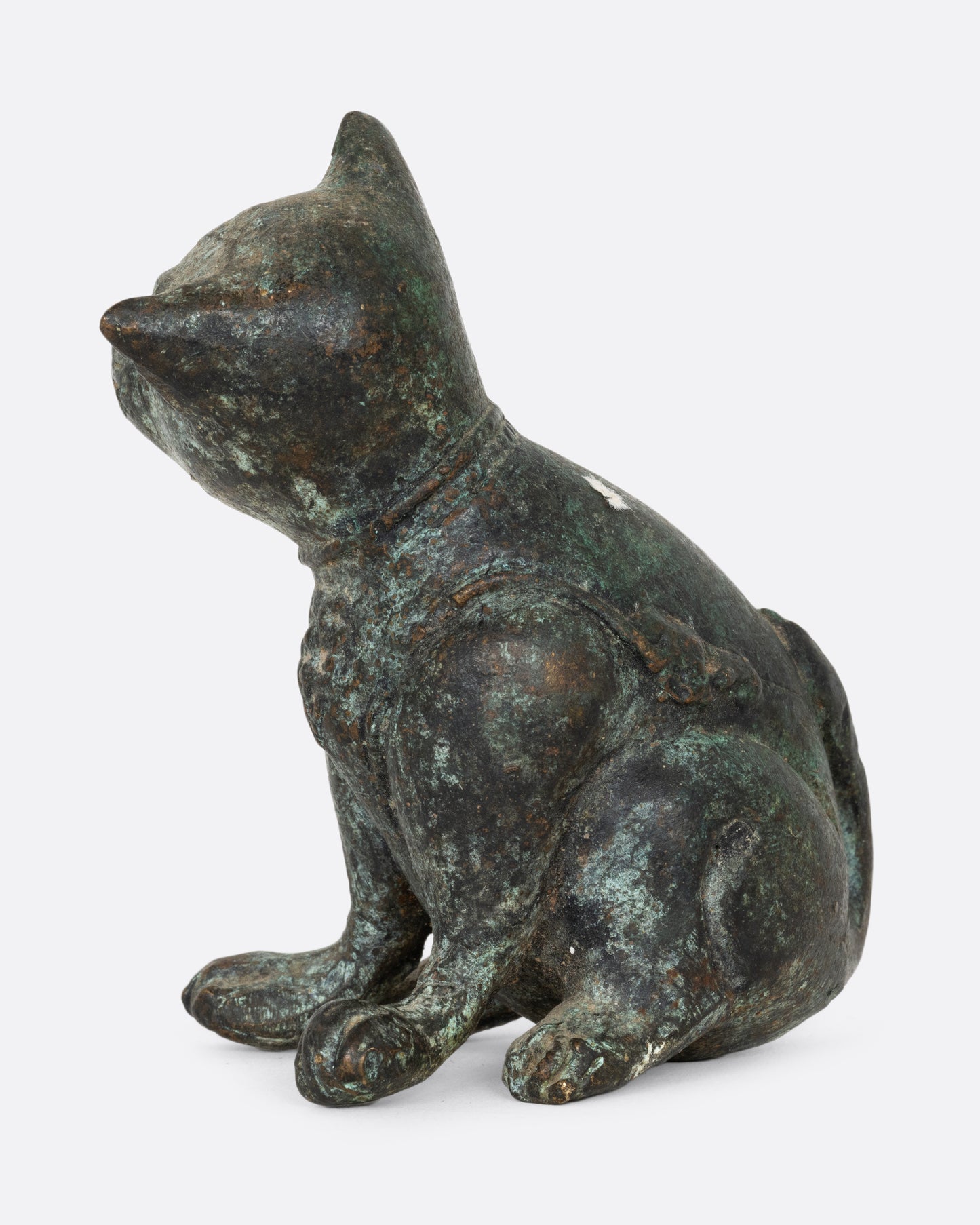 An antique cast iron dog, shown from the side.