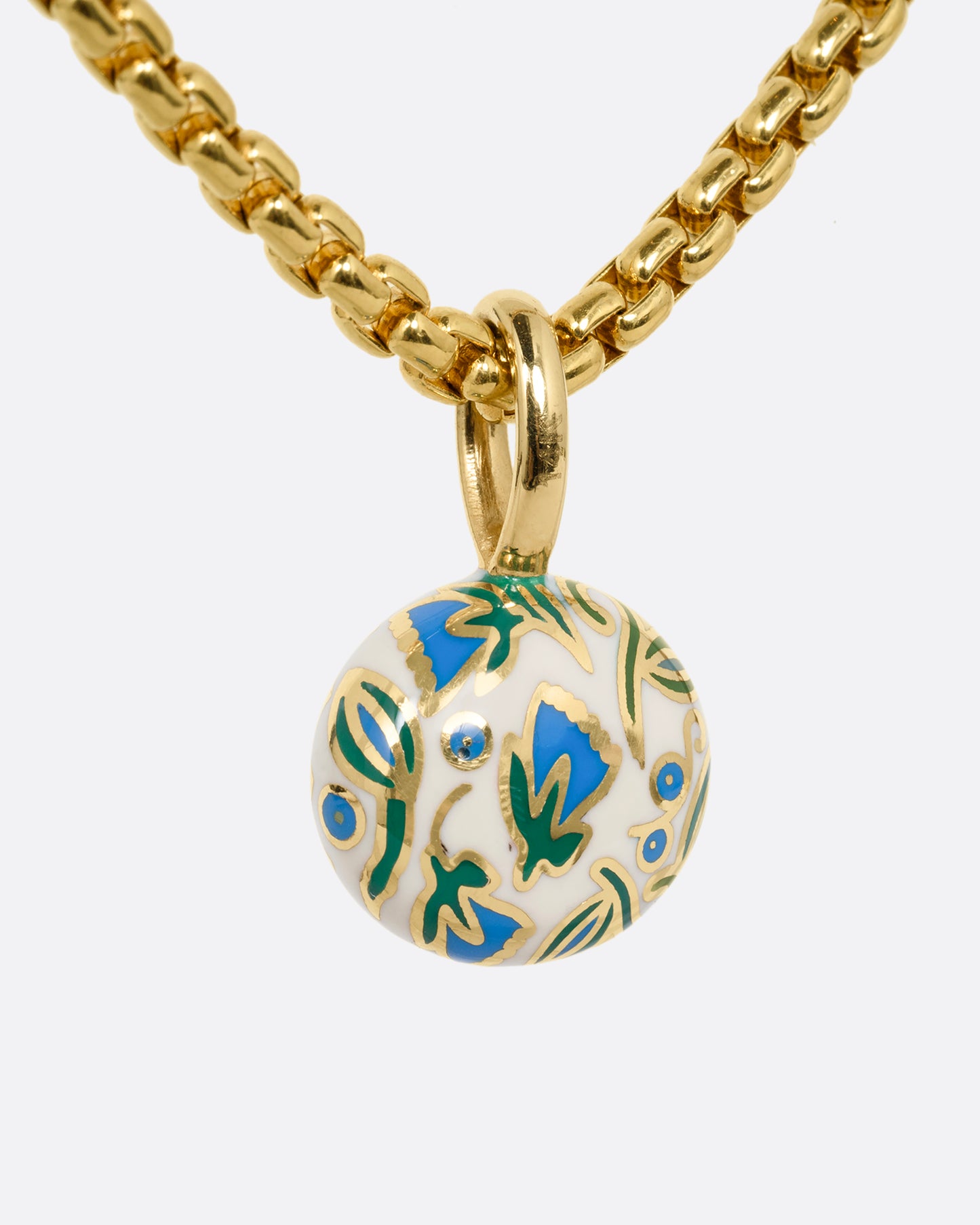 yellow gold ruby pendant with enamel shown from the back