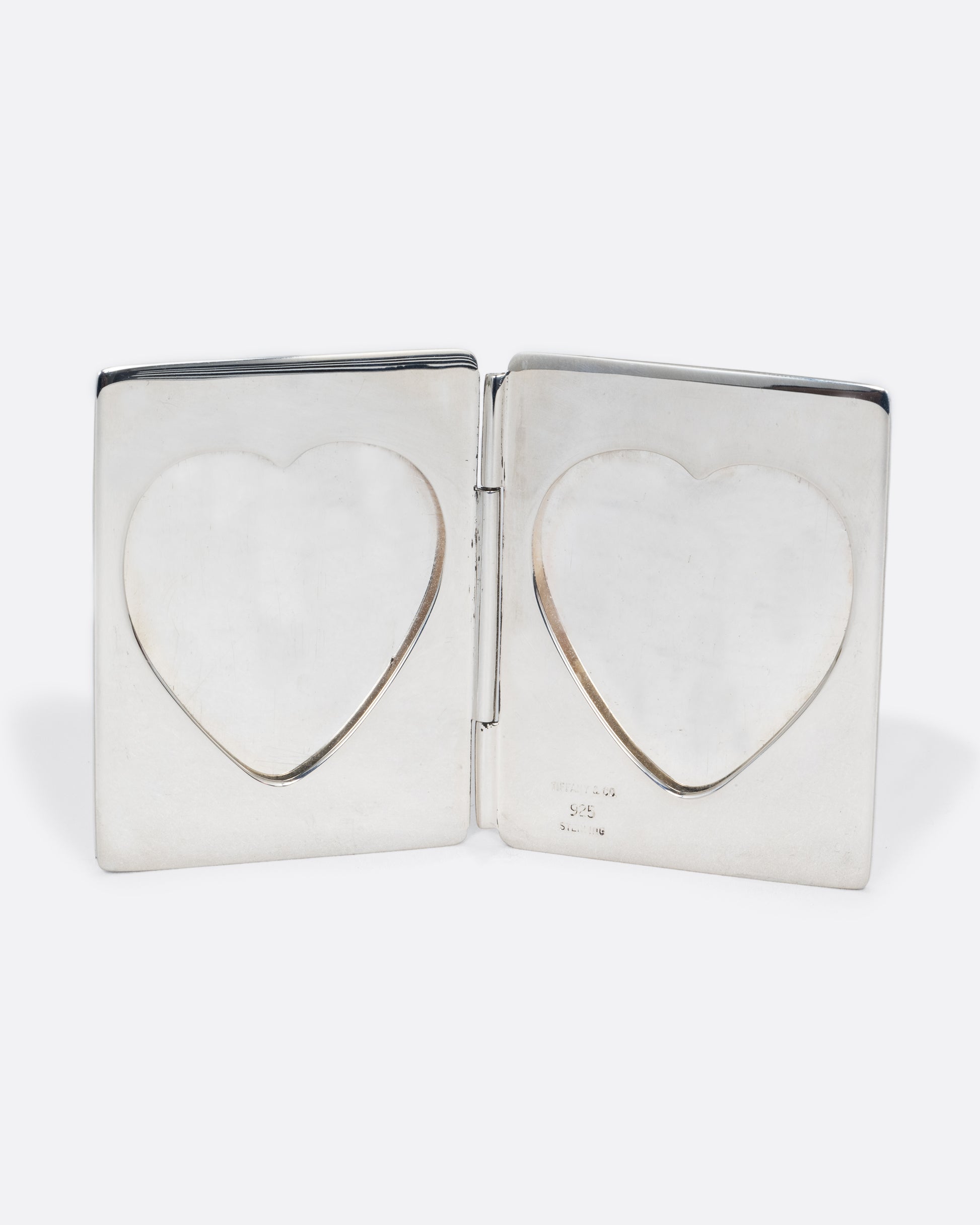 vintage sterling silver heart shaped frame shown open
