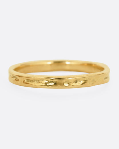 Karen Karch Everlasting band in 18k yellow gold, a slim 2.5mm band with a weathered hand-textured surface and straight edges