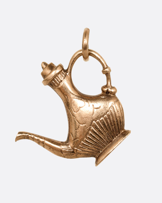 A yellow gold oil lamp charm. Shown from the front.