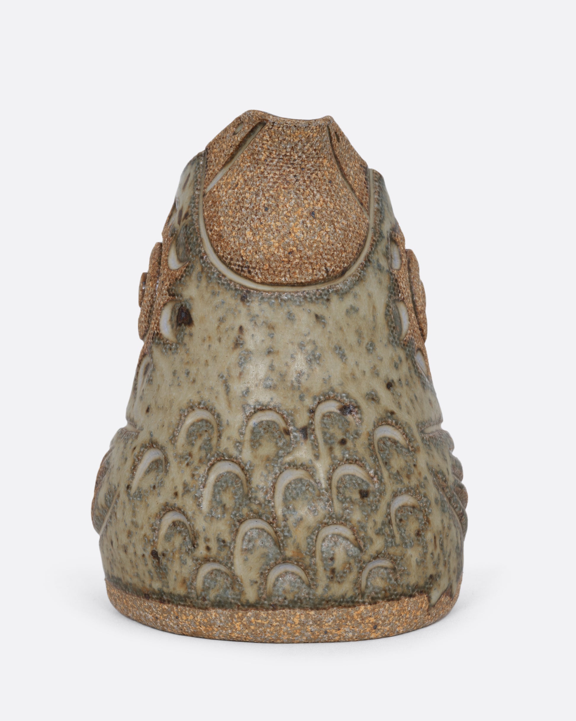 A spotted bird shaped creamer. Shown from the front.