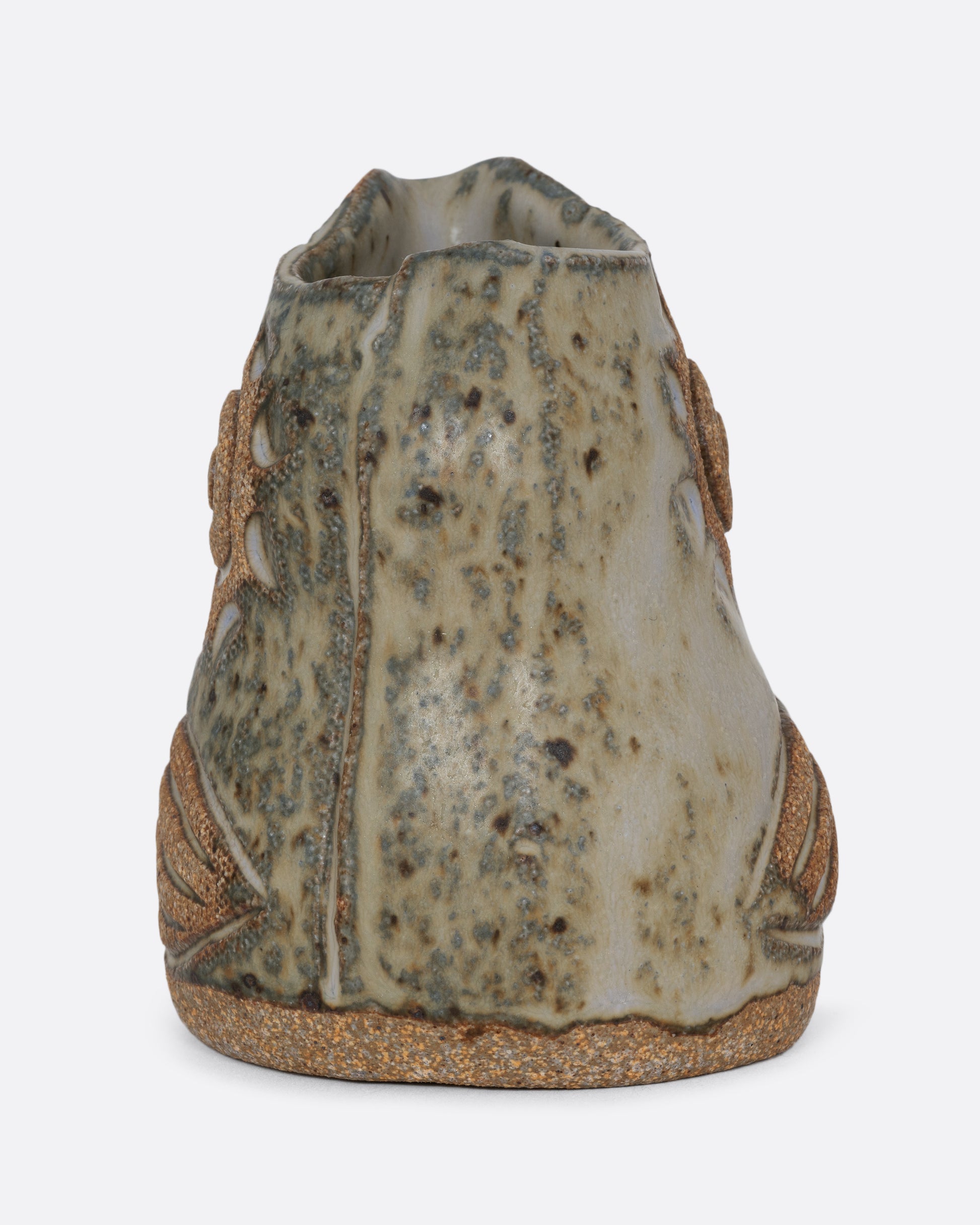 A spotted bird shaped creamer. Shown from the back.