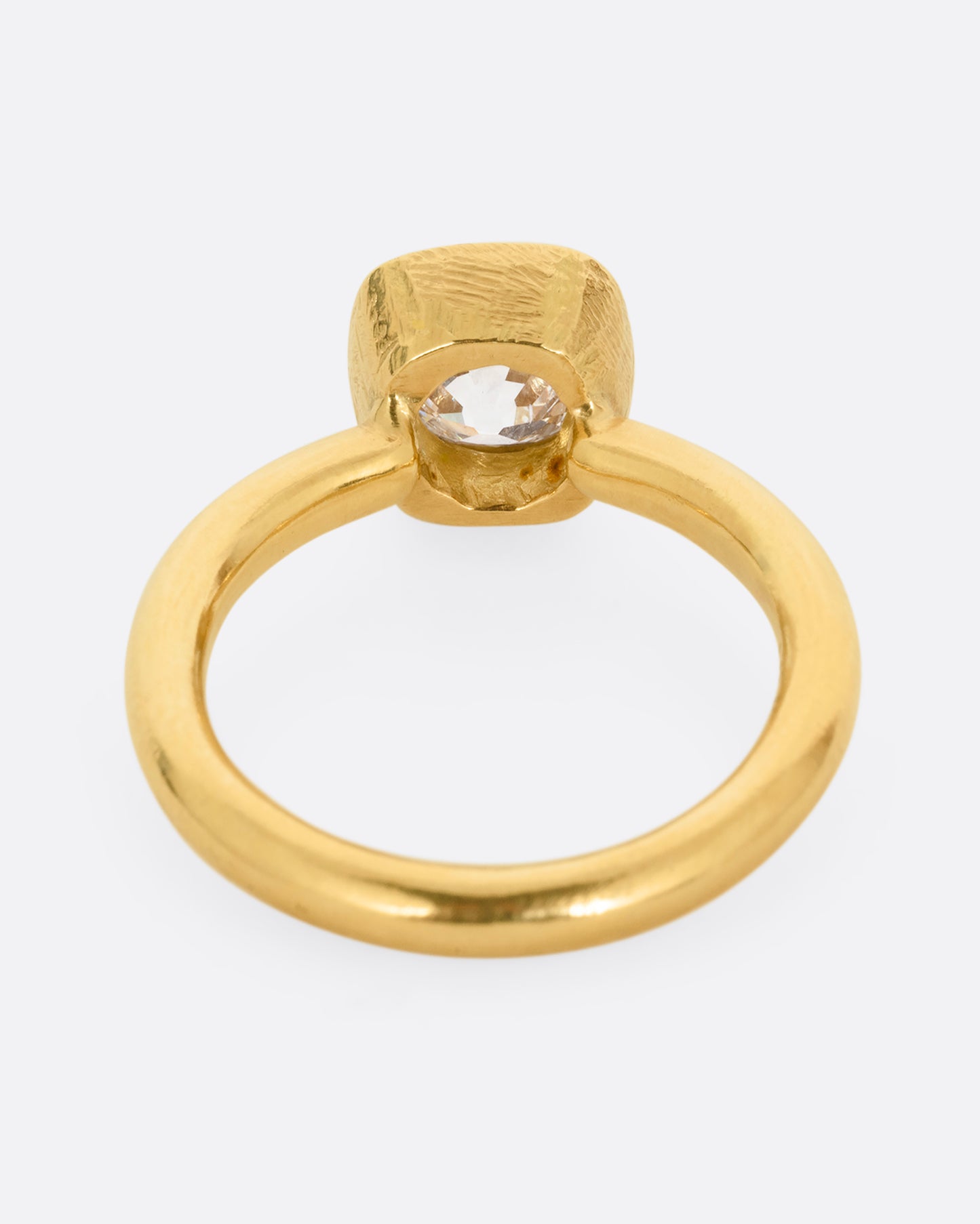 A yellow gold ring with an Old Mine Cut Diamond. Shown from the back.