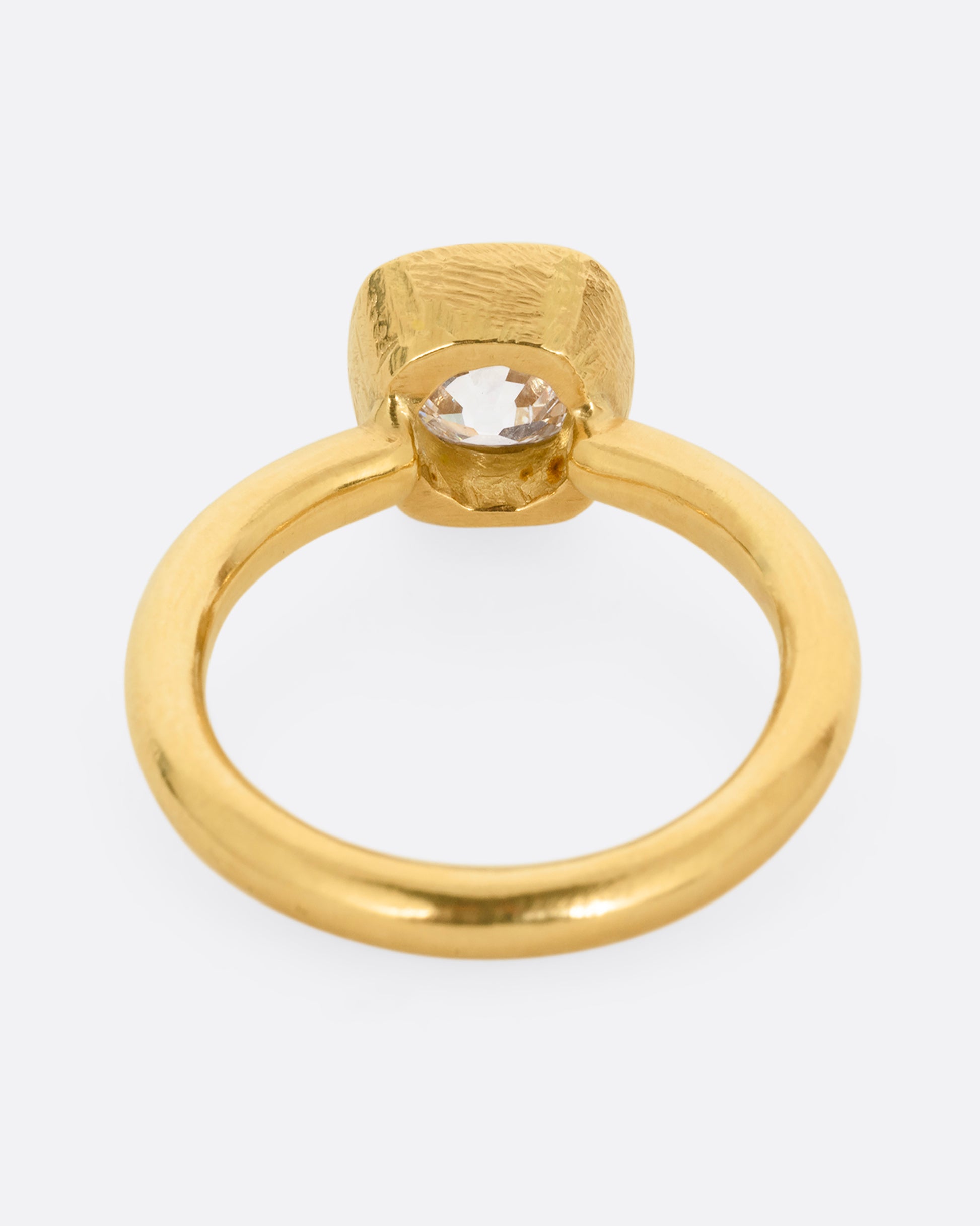 A yellow gold ring with an Old Mine Cut Diamond. Shown from the back.