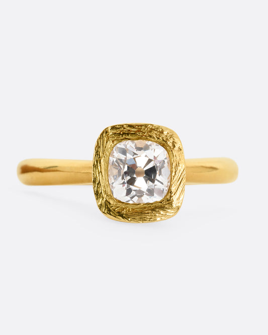 A yellow gold ring with an Old Mine Cut Diamond. Shown from the front.