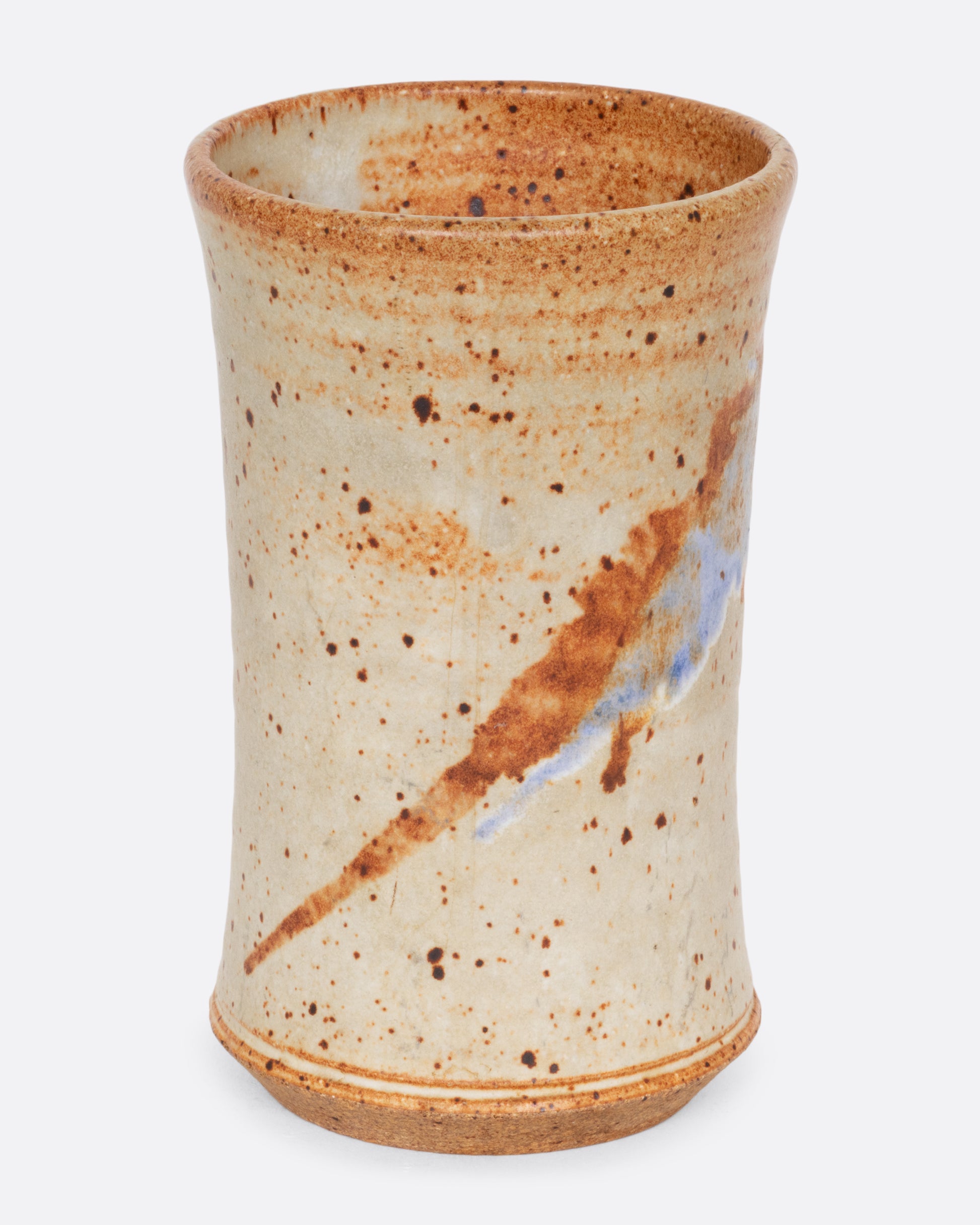 A tall speckled vessel with blue and brown splattered glaze. Shown from the front.
